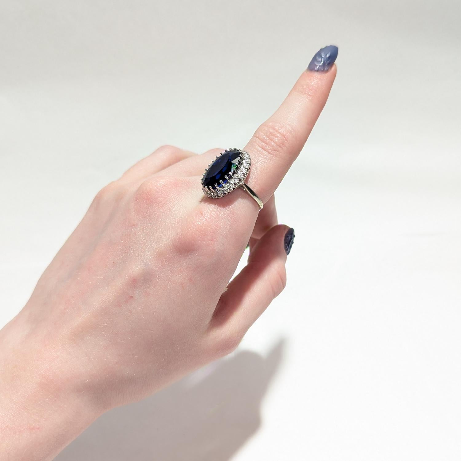 Modern 14 Karat White Gold, Diamond, and Large Blue Topaz Cocktail Ring For Sale