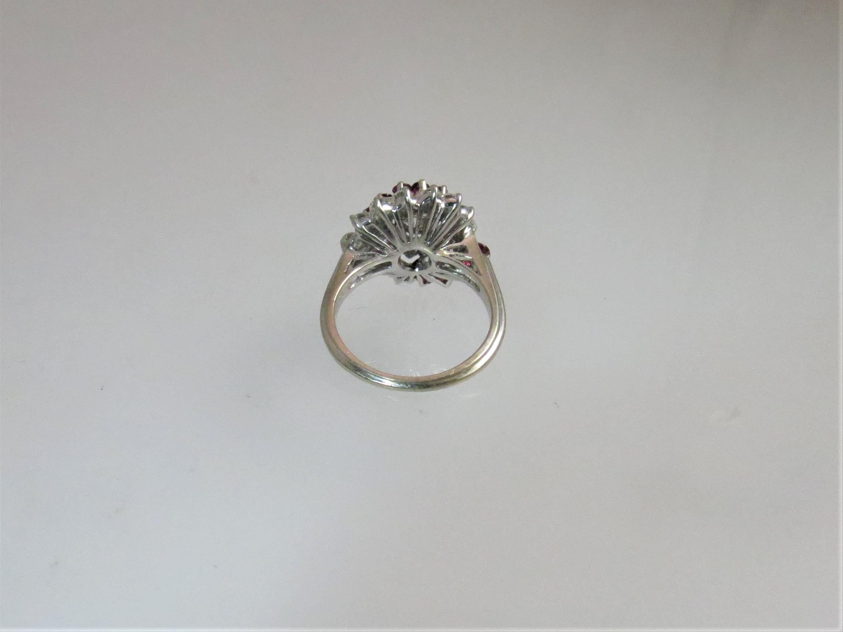 Round Cut 14 Karat White Gold Diamond and Ruby Swirl Design Ring For Sale
