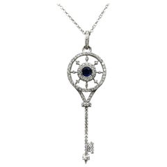 14 Karat White Gold Diamond and Sapphire Key Pendant