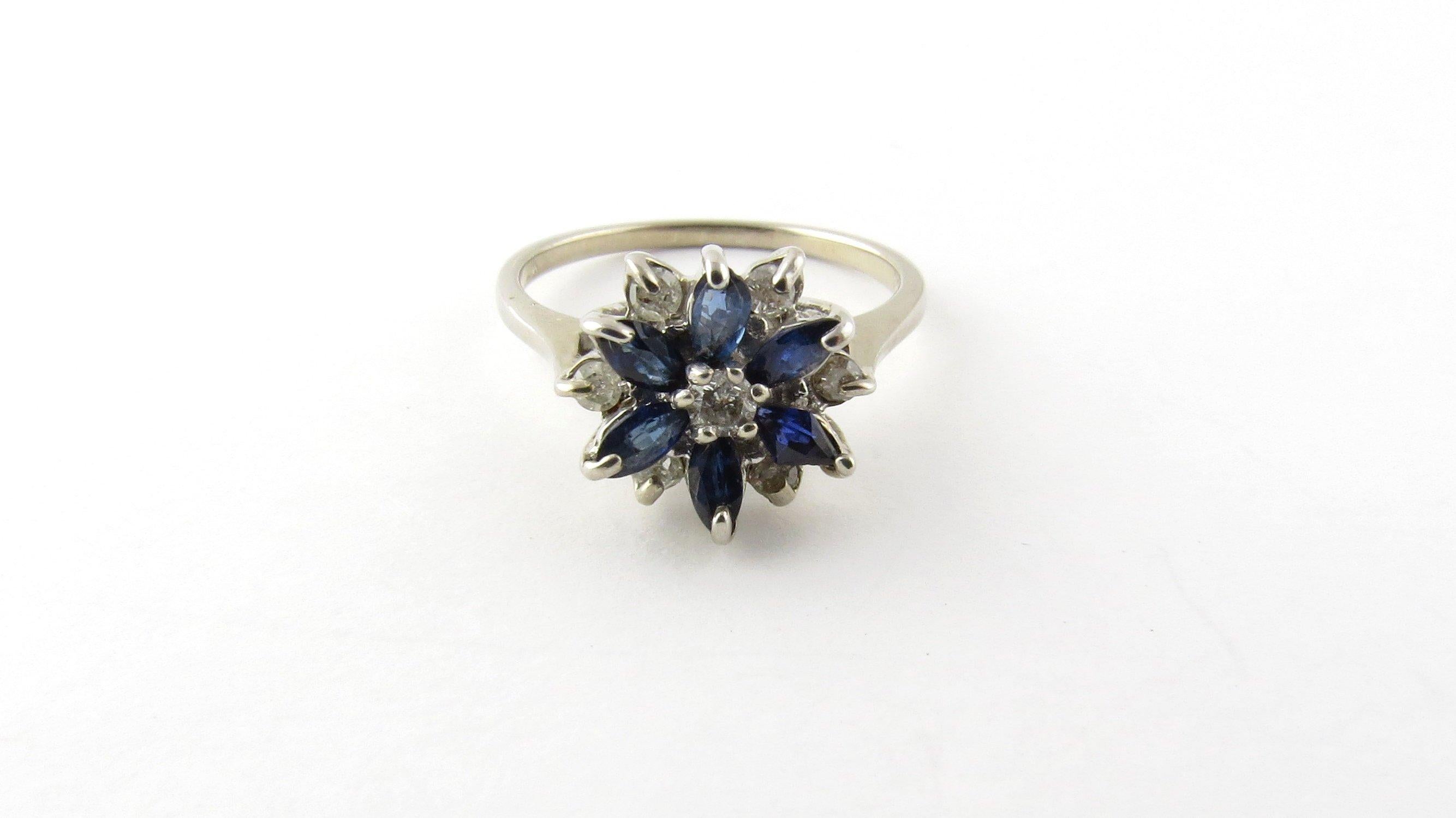Vintage 14 Karat White Gold Diamond and Sapphire Ring Size 5.75- 
This elegant ring features six genuine marquis sapphires, one round brilliant cut diamond (center) and six round single cut diamonds set in a lovely floral design. Top of ring