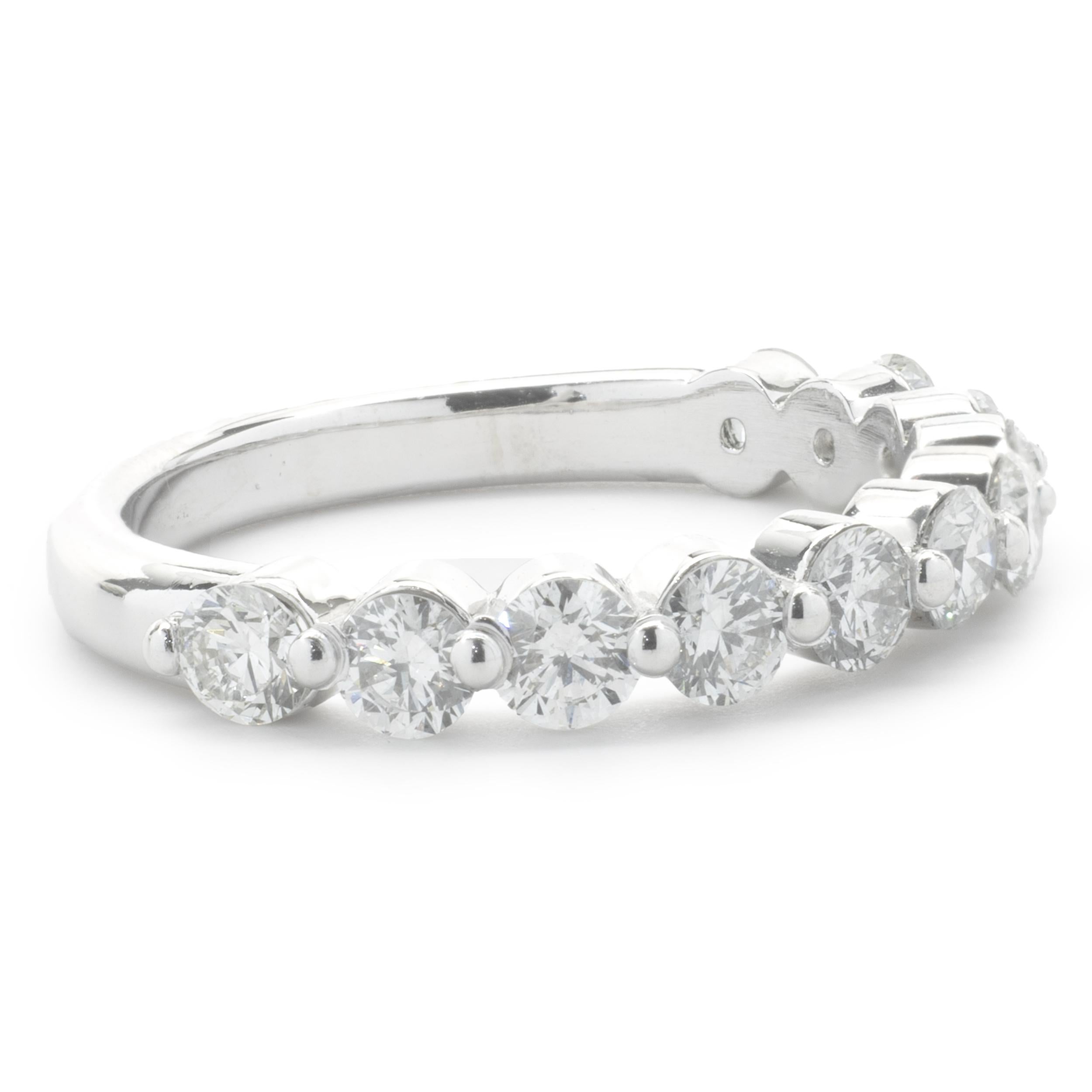 Designer: custom
Material: 14K white gold
Diamond: 11 round brilliant= 1.10cttw
Color: H
Clarity: SI1
Ring size: 4.5 (please allow two additional shipping days for sizing requests)
Weight:  2.72 grams
