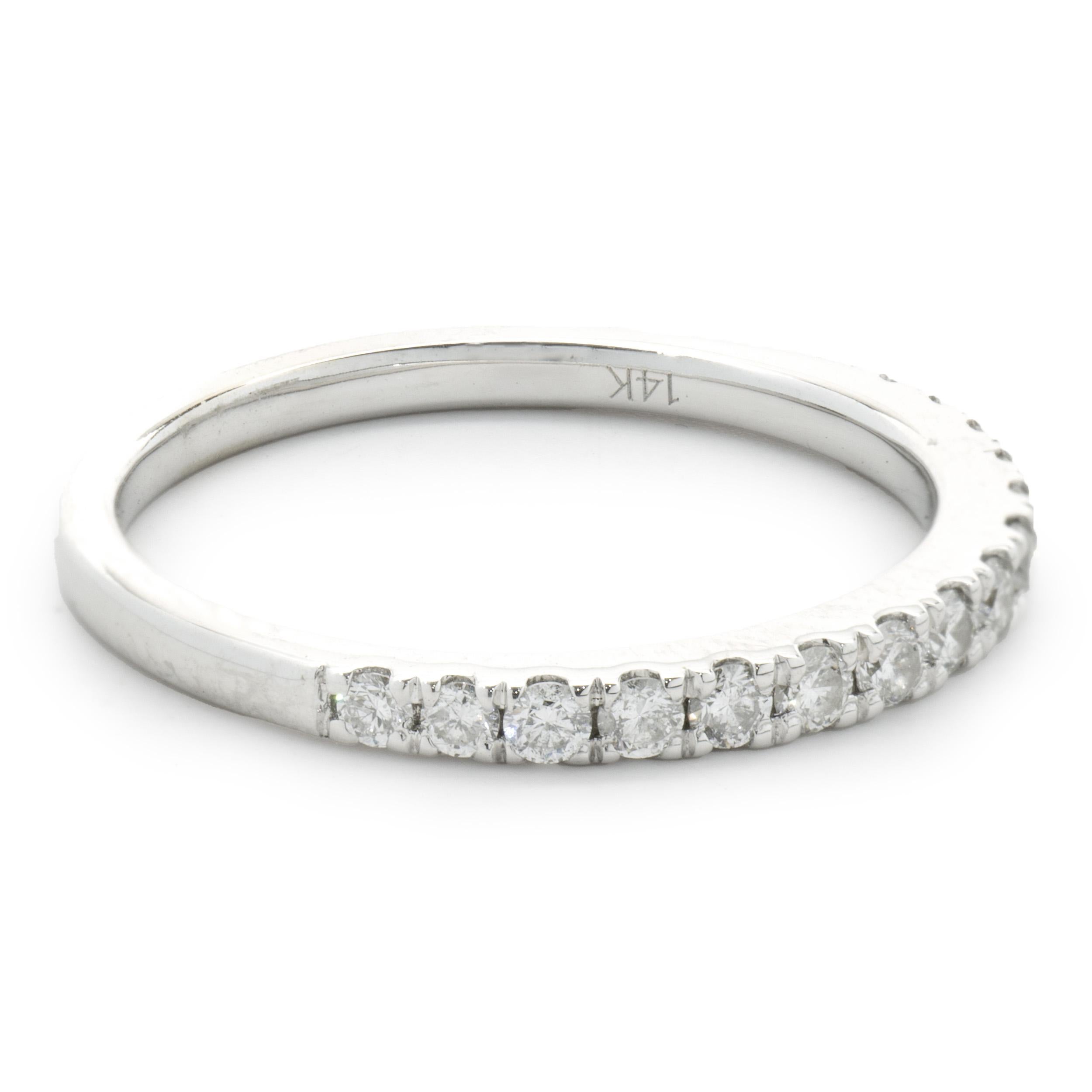 Designer: Custom
Material: 14K white gold
Diamonds: 15 round brilliant cut = 0.45cttw
Color: H
Clarity: SI1
Size: 7 sizing available 
Dimensions: ring measures 2mm in width
Weight: 2.18 grams