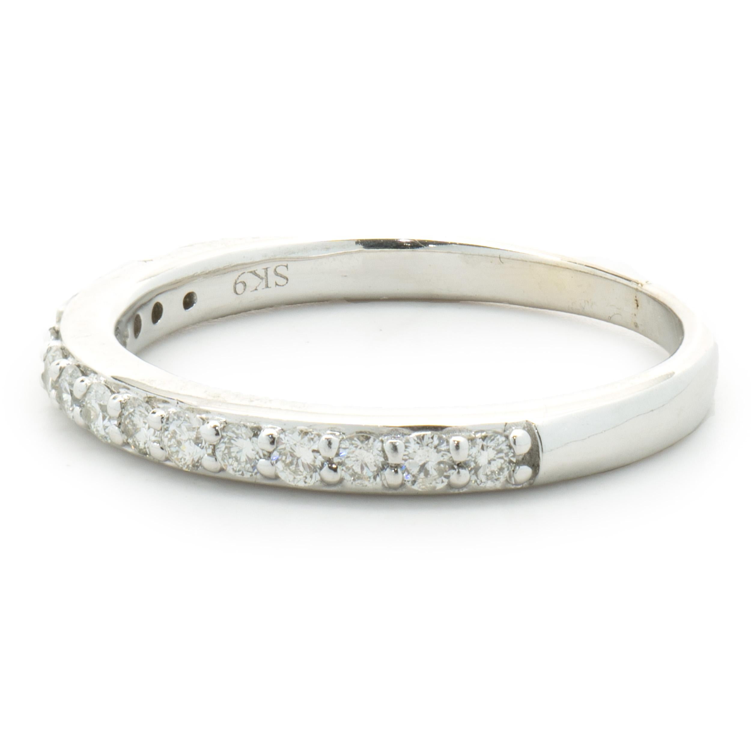 Designer: Custom
Material: 14K white gold
Diamonds: 15 round brilliant cut = 0.15cttw
Color: G 
Clarity: SI1
Size: 5.25 sizing available 
Dimensions: ring measures 2mm in width
Weight: 2.15 grams