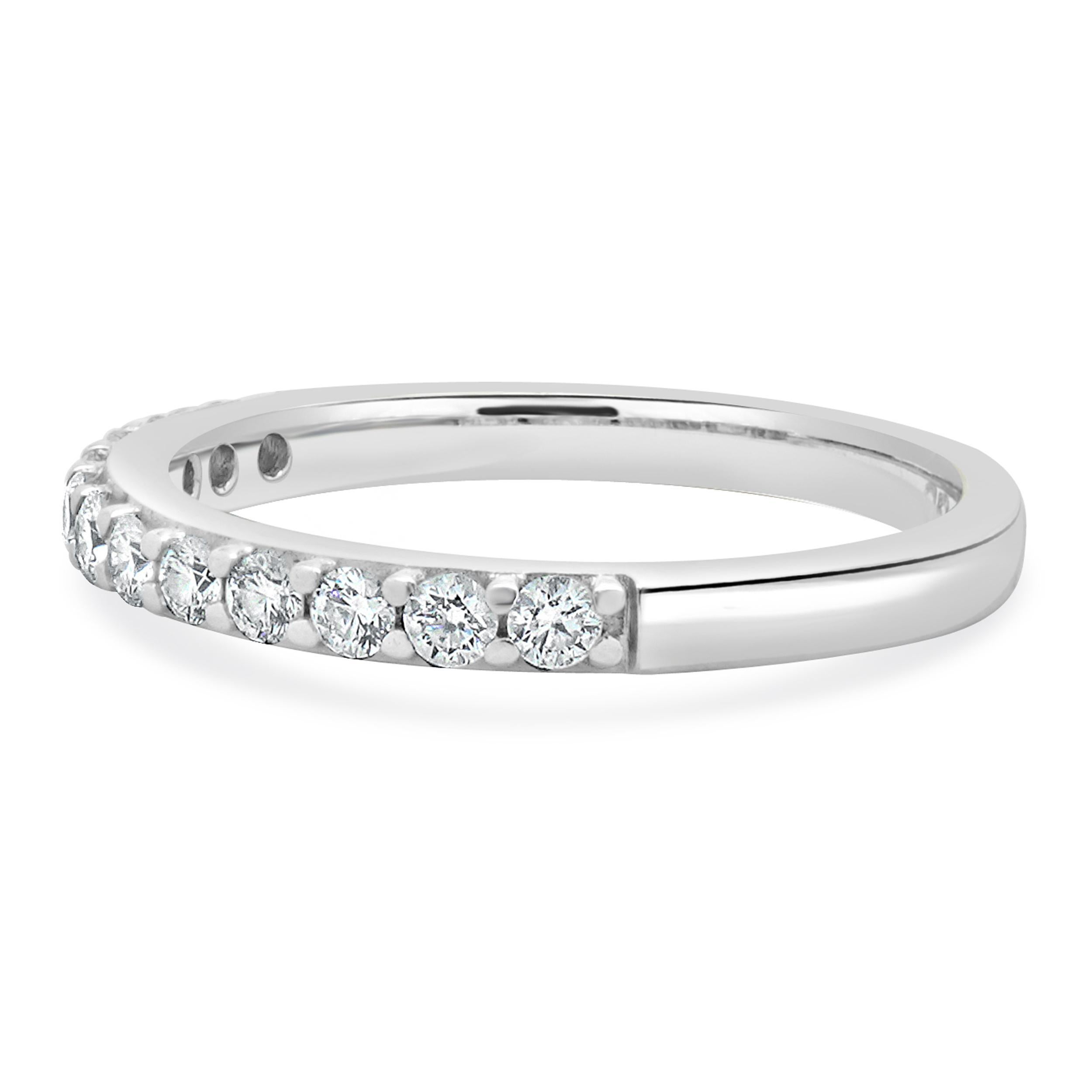 Designer: custom
Material: 18K white gold
Diamond: 12 round brilliant cut = 0.24cttw
Color: H
Clarity: SI1
Ring size: 5.25 (please allow two additional shipping days for sizing requests)
Weight: 2.56 grams