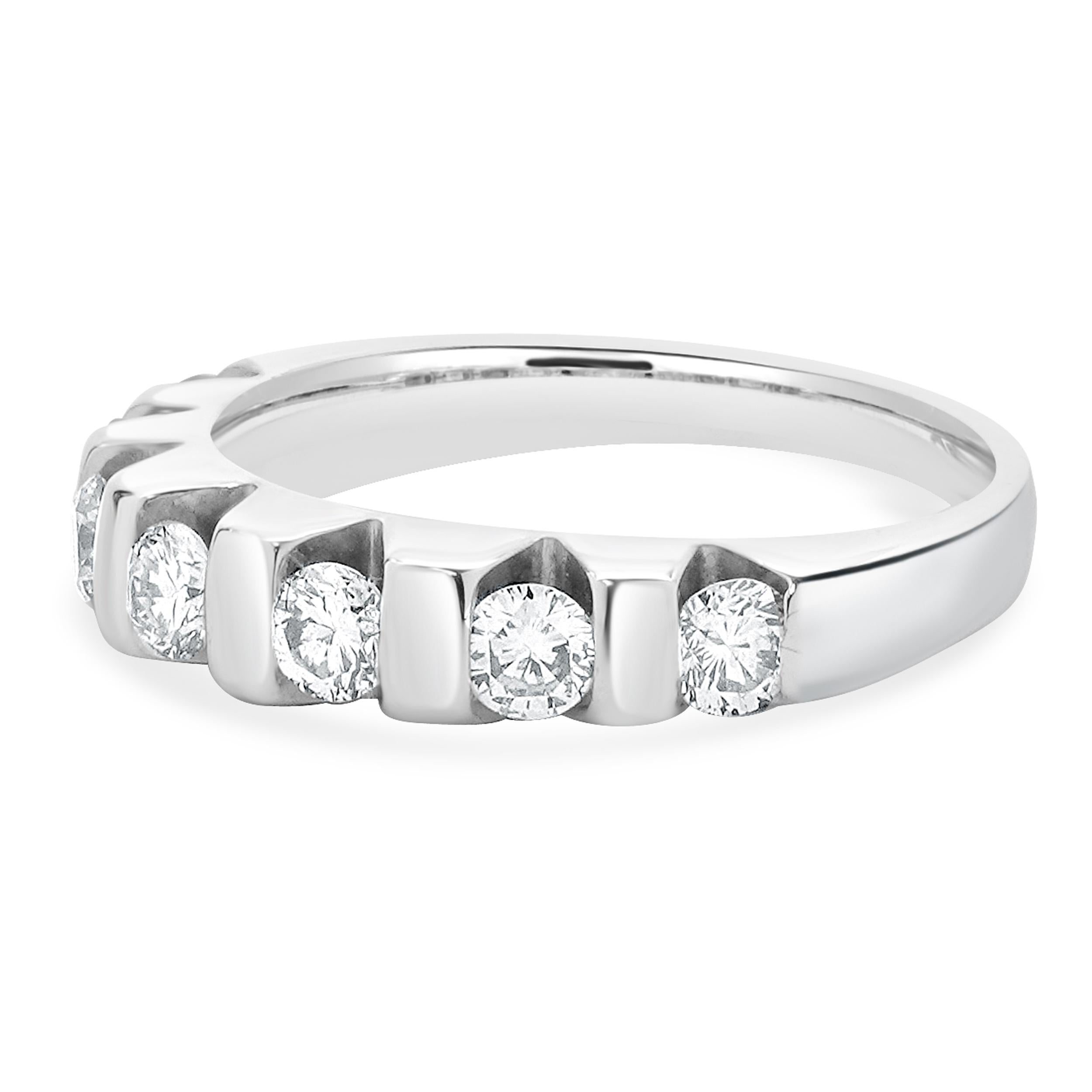 Designer: custom
Material: 14K white gold
Diamond: 7 round brilliant = 1.05cttw
Color: K
Clarity: SI1
Ring size: 8.5 (please allow two additional shipping days for sizing requests)
Weight: 5.90 grams
