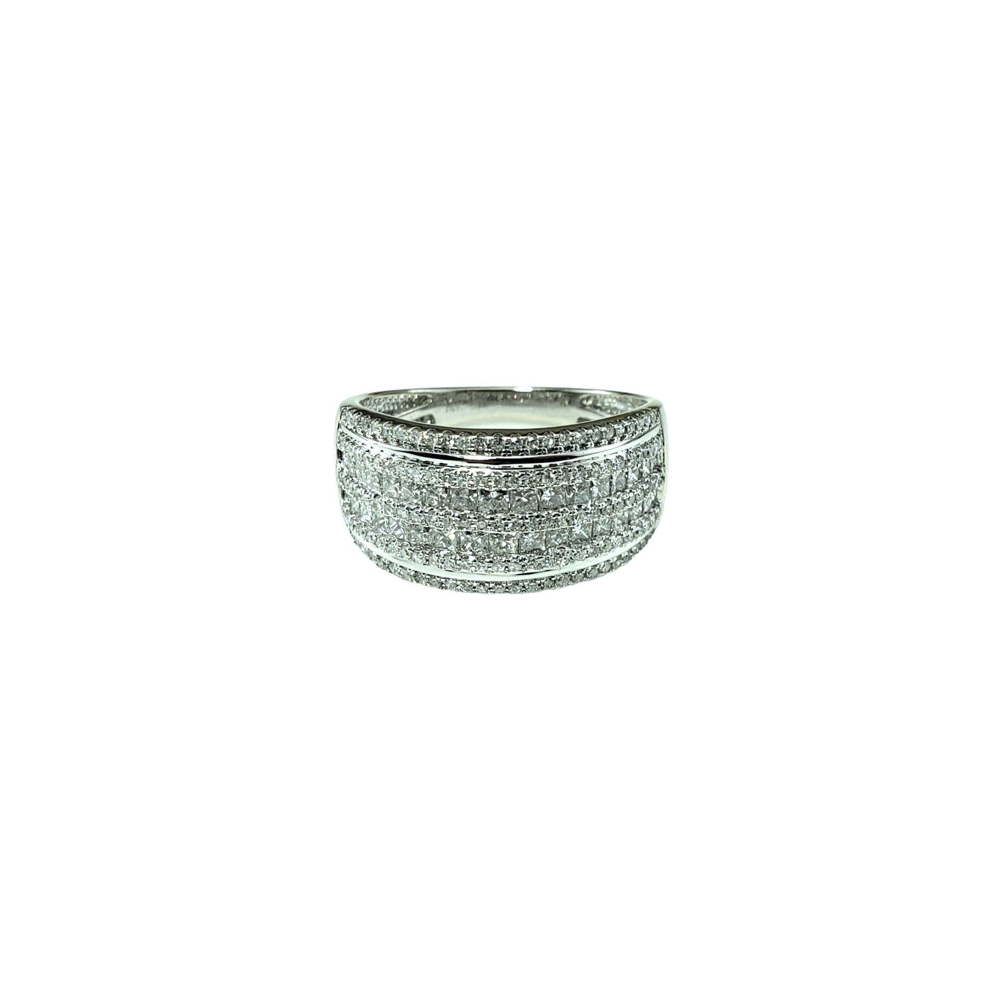 14K White Gold Diamond Band Ring Size 7.5-

This sparkling band features 34 princess cut diamonds and 146 round single cut diamonds set in classic 14K white gold. 

 Width:  10 mm.  Shank: 2 mm.

Approximate total diamond weight:  1.75 ct.

Diamond