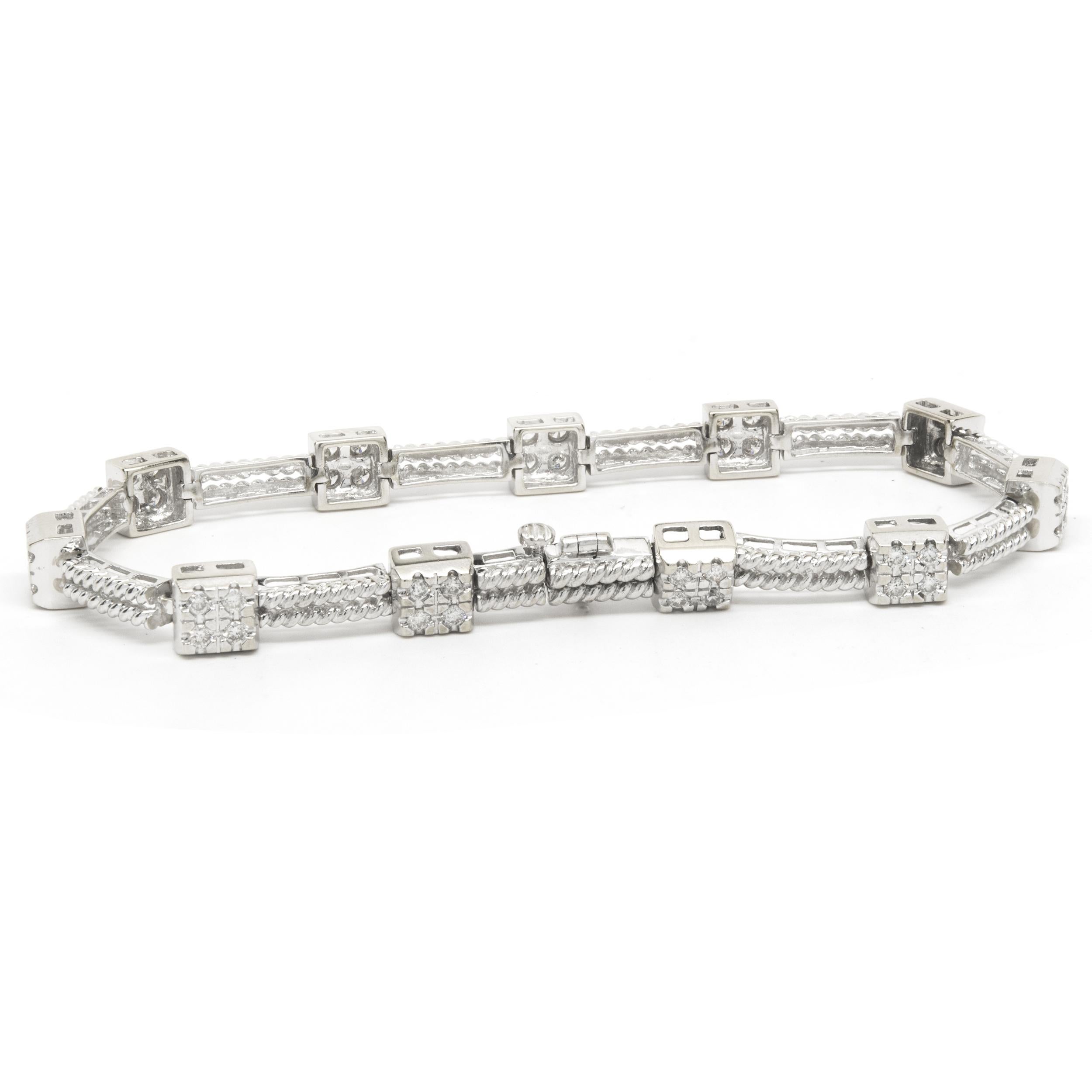 Designer: custom
Material: 14K white gold
Diamond: 44 round brilliant= 1.00cttw
Color: H
Clarity: SI1
Dimensions: bracelet will fit up to a 6.75-inch wrist
Weight: 14.83 grams
