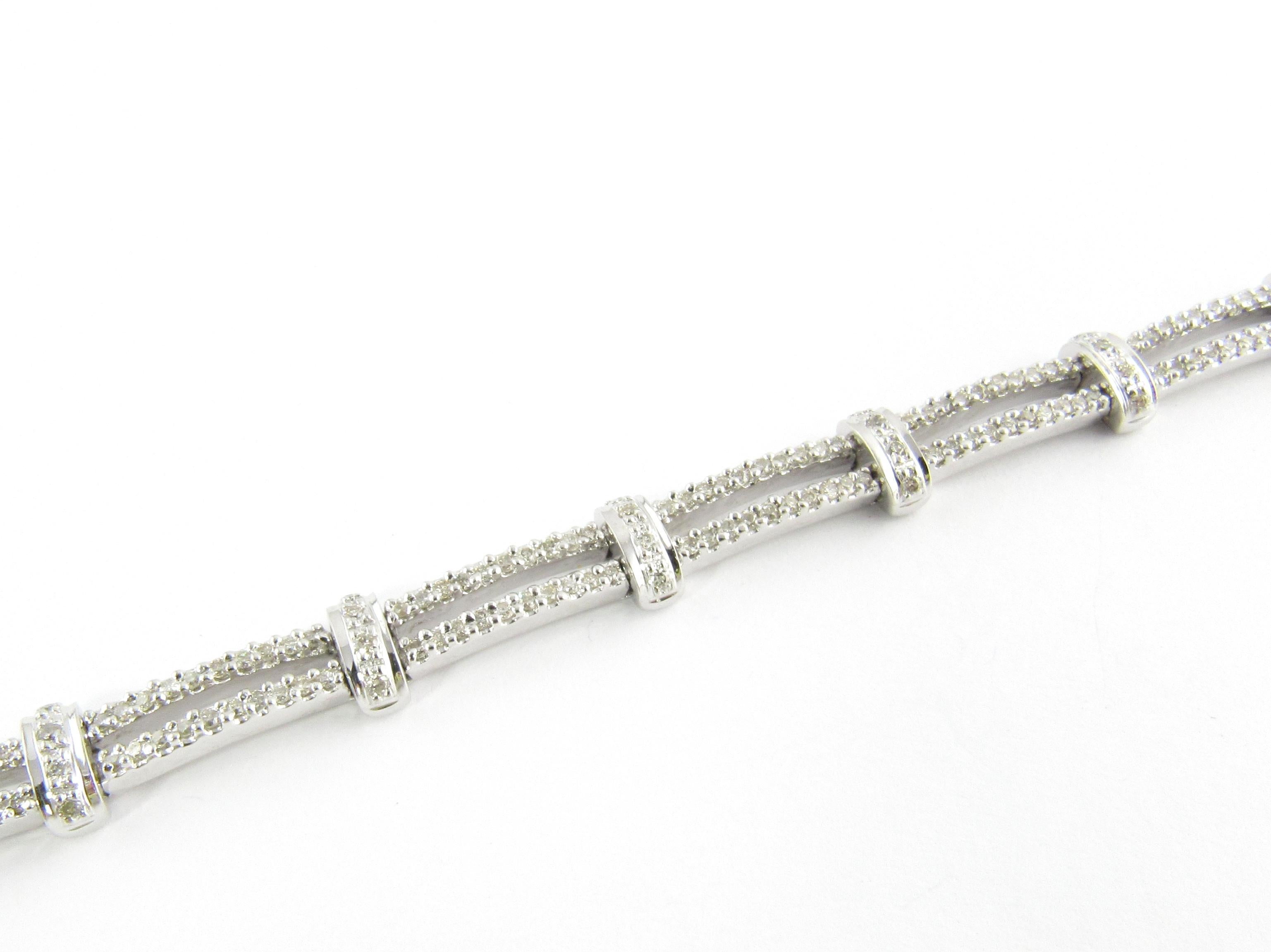 Vintage 14 Karat White Gold Diamond Bracelet

This stunning bracelet features 284 round brilliant cut diamonds set in beautifully detailed 14K white gold. Width: 6 mm. Safety closure.

Approximate total weight: 1.4 cts.

Diamond color: K-L

Diamond