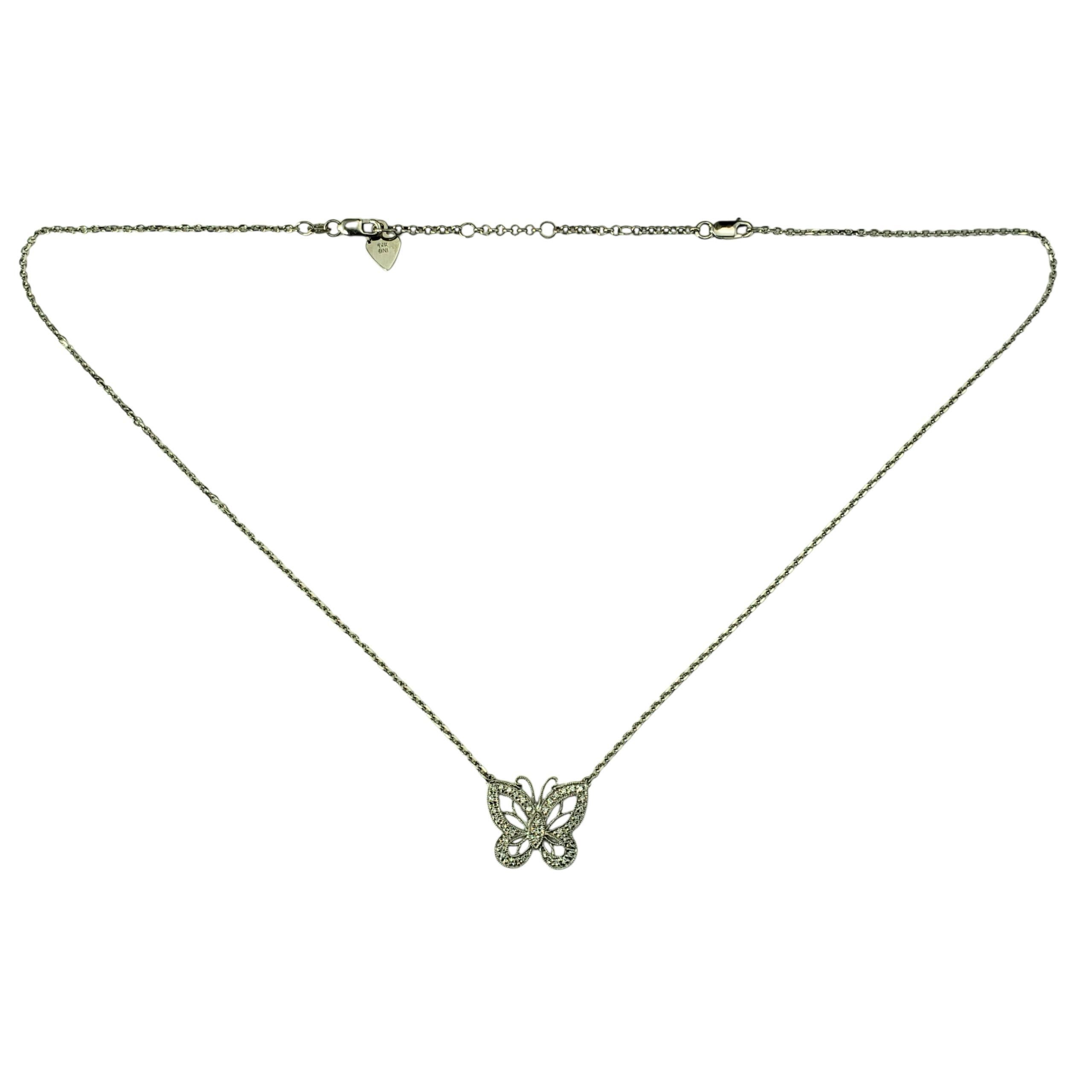 14 Karat White Gold and Diamond Butterfly Pendant Necklace-

Delicate and dazzling, this 14K white gold butterfly pendant necklace is a graceful blend of elegance and symbolism. The butterfly, a timeless symbol of transformation and beauty, is