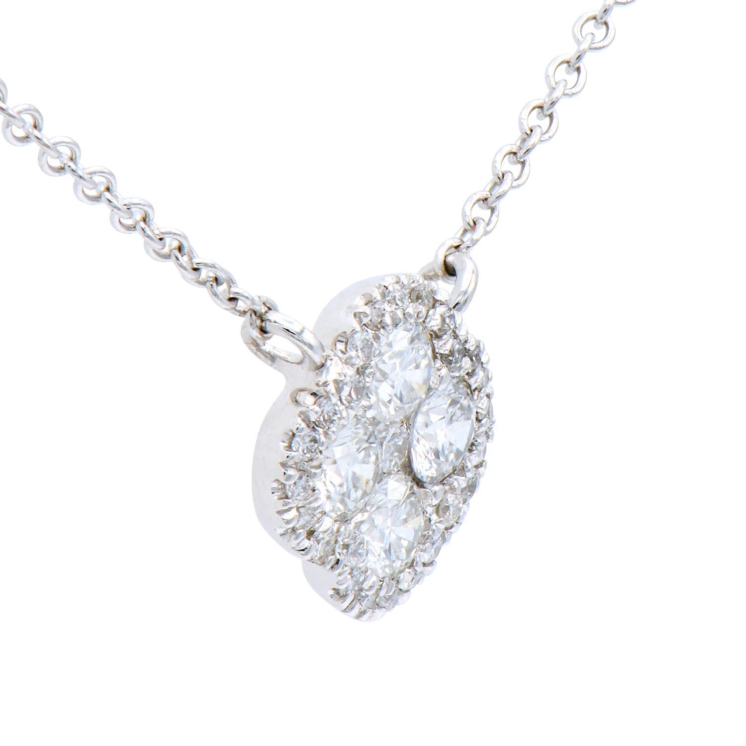 This beautiful necklace uses a variety of diamond sizes to create a stunning cluster. There are 29 SI1, H color diamonds totaling 0.21 carats. They are set in 2.3 grams of 14 karat white gold with a 14 karat white gold wheat chain attached. This