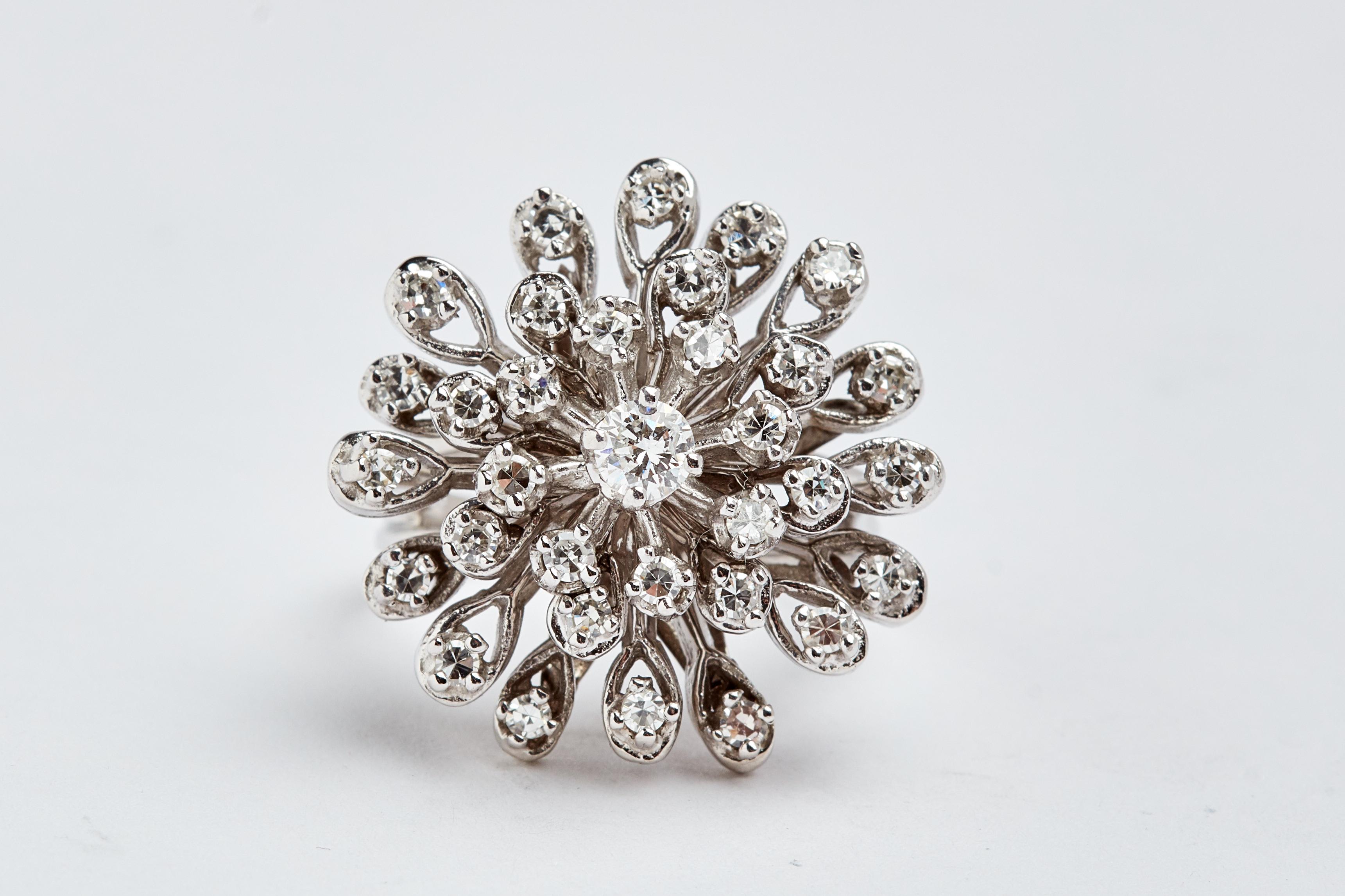 14k white gold diamond cluster ring. 35 single round white diamond. 1.75 carats total. 1 full cut diamond white round 0.40 carats. Size 10. 2.15 carats total weight for the entire ring. 