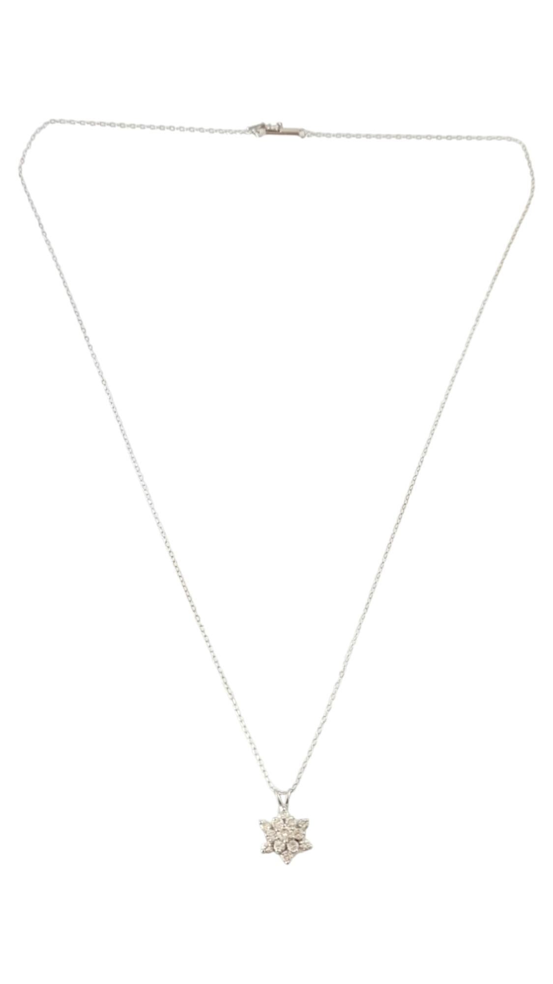 This sparkling pendant features 13 round brilliant cut diamonds (center: .08 ct., surrounding: .03 ct each) set in beautifully detailed 14K white gold.  Suspended from a classic 14K white gold necklace.

Approximate total diamond weight:  .44