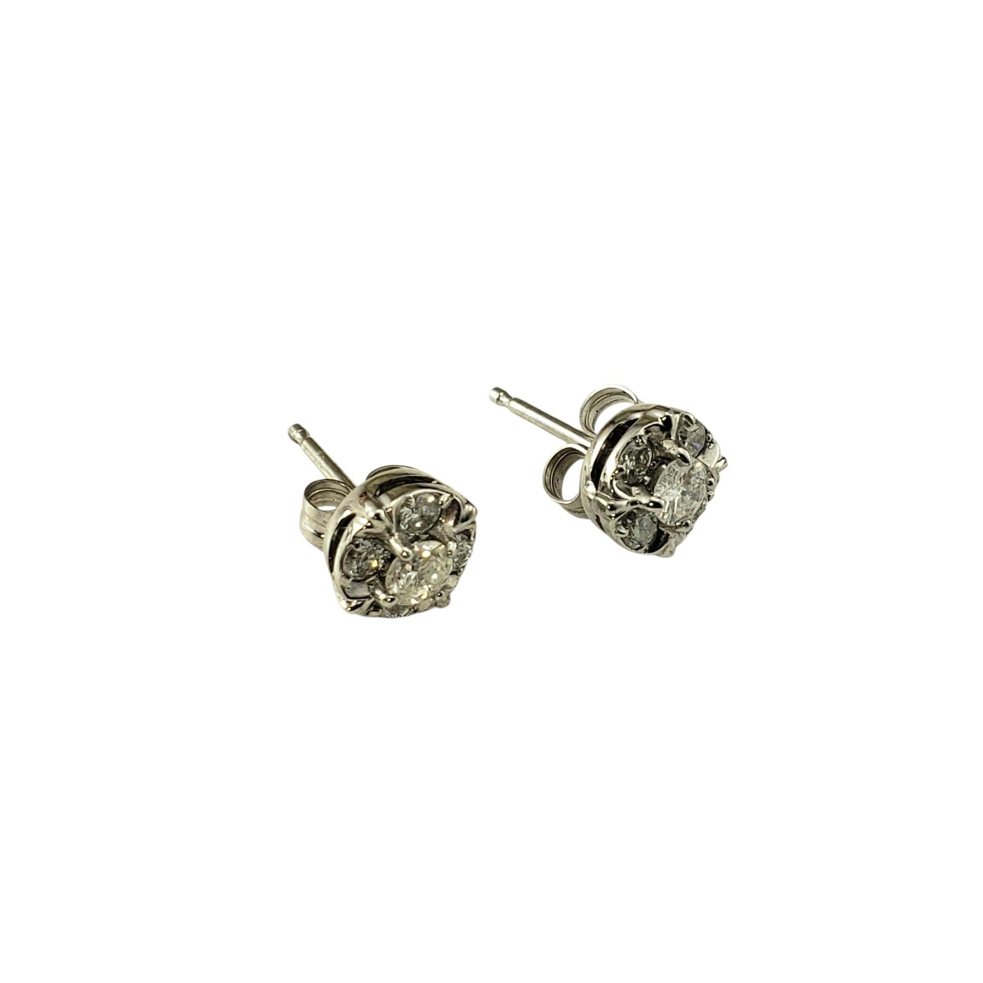 14 Karat White Gold Diamond Cluster Stud Earrings-

These sparkling earrings each feature five round brilliant cut diamonds set in classic 14K white gold. Push back closures.

Approximate total diamond weight: .38 -  .44 ct.

Diamond color: