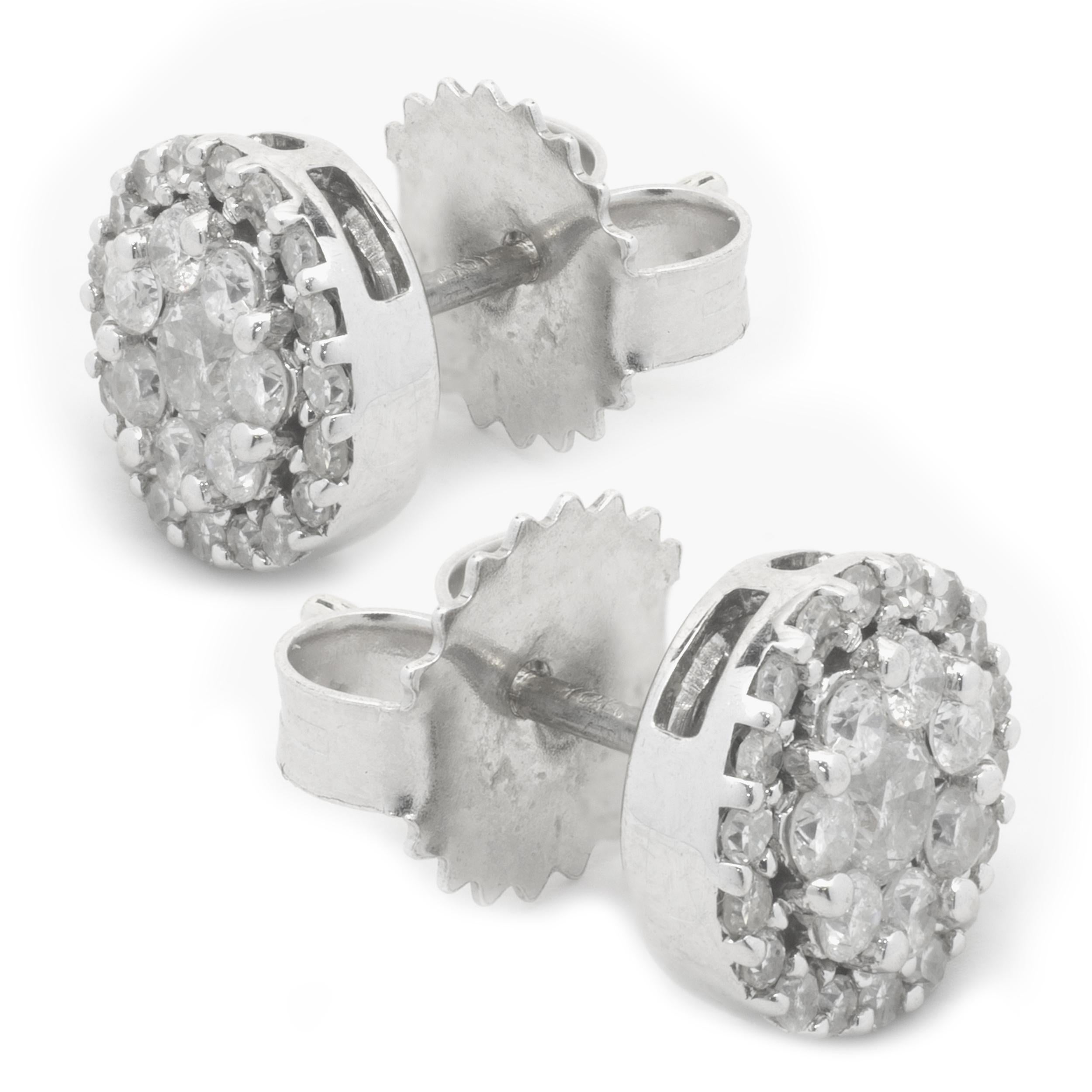 Designer: custom design
Material: 14K white gold
Diamonds: 26 round cut = 1.00cttw
Color: G
Clarity: SI2
Dimensions: earrings measure 7.50mm
Fastenings: post with friction backs
Weight: 1.72 grams
