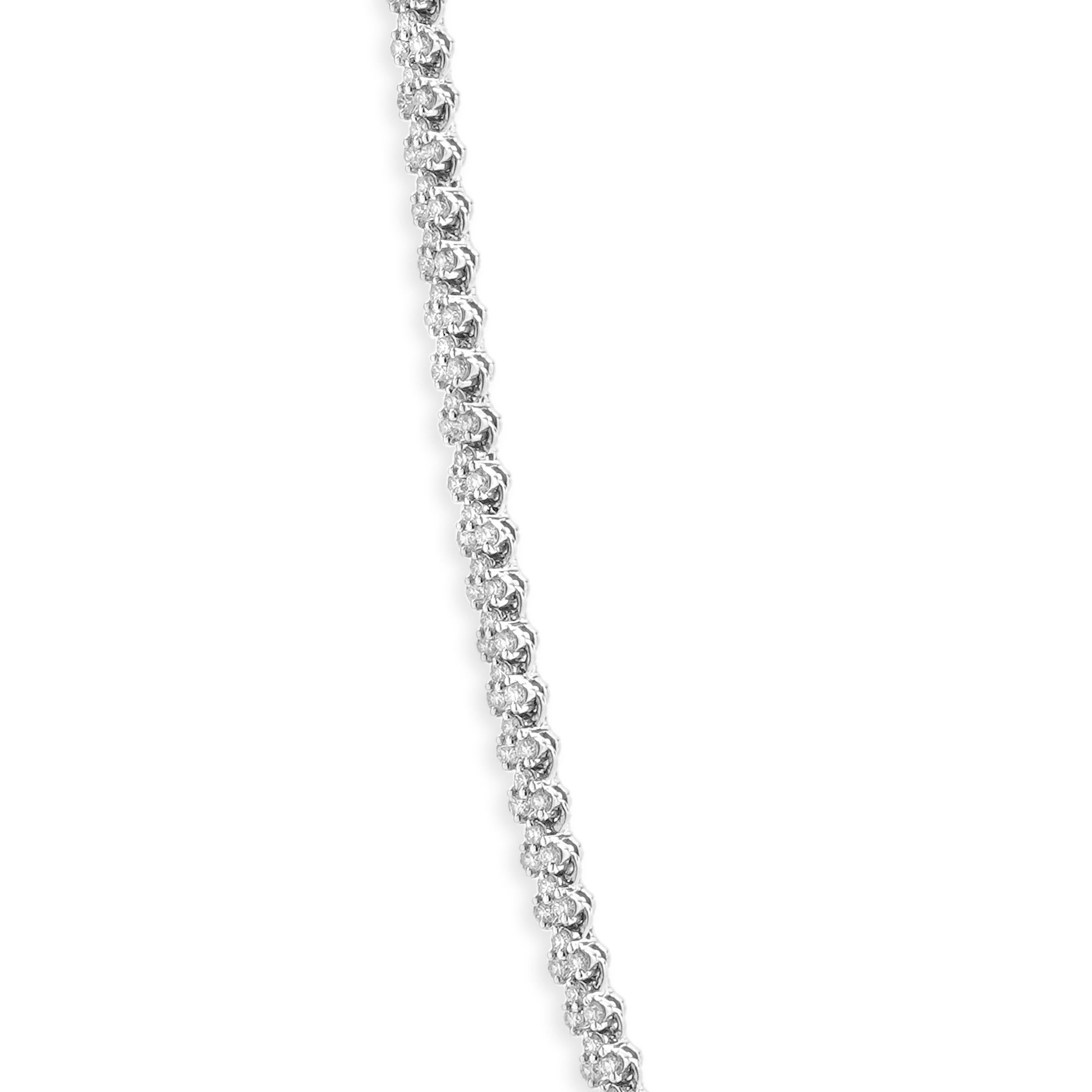 Designer: custom
Material: 14K white gold
Diamonds: round brilliant cut = 6.03cttw
Color: H
Clarity: SI1
Dimensions: necklace measures 18-inches in length
Weight: 19.26 grams