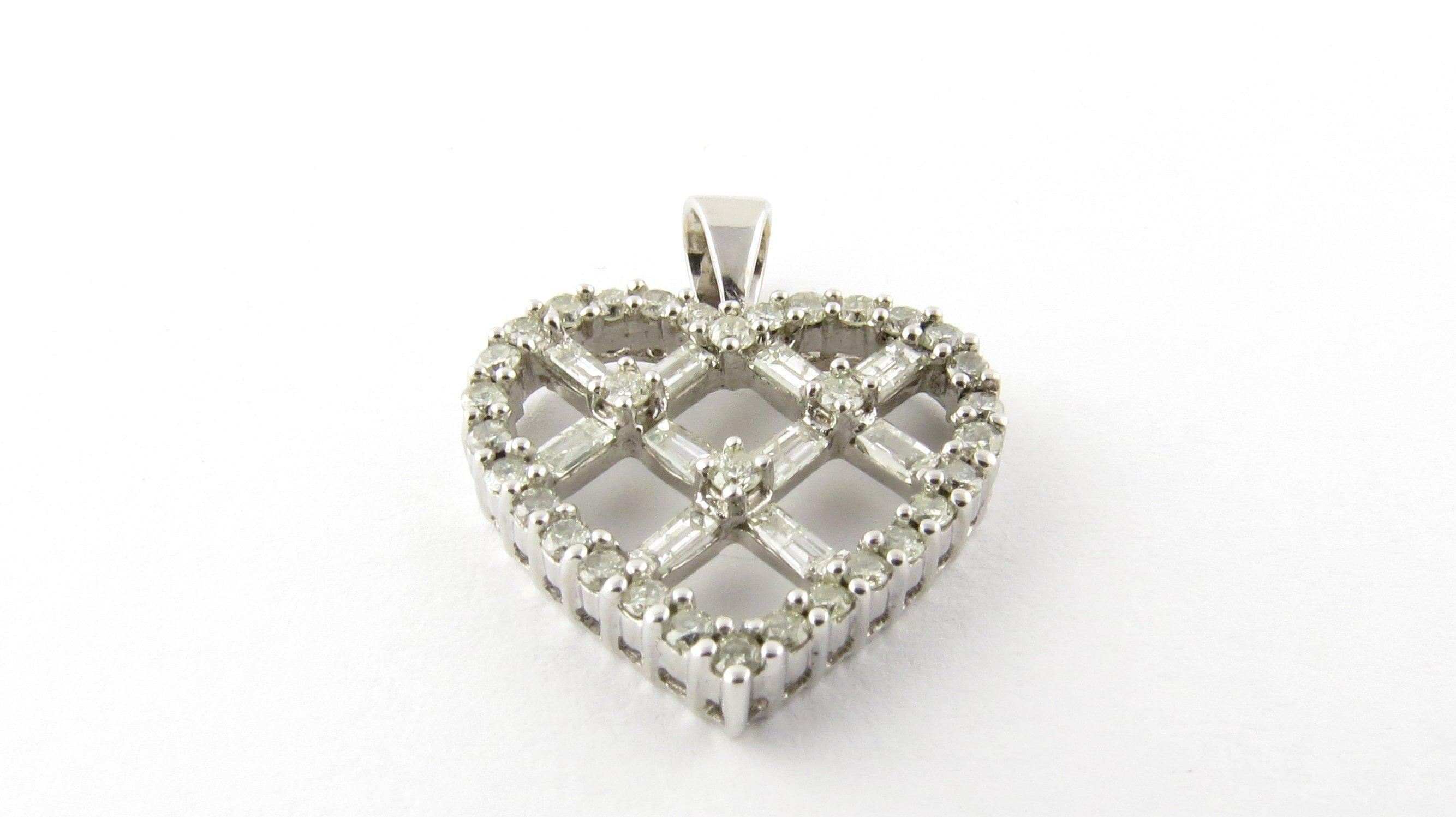 Vintage 14K white gold and diamond criss cross heart pendant. 

Criss cross my heart with diamonds!! 

29 round brilliant diamonds at approx. .29ct each. 10 baguette diamonds at approx. .12ct each. Approx diamond twt .50ct. I clarity. J-K color.