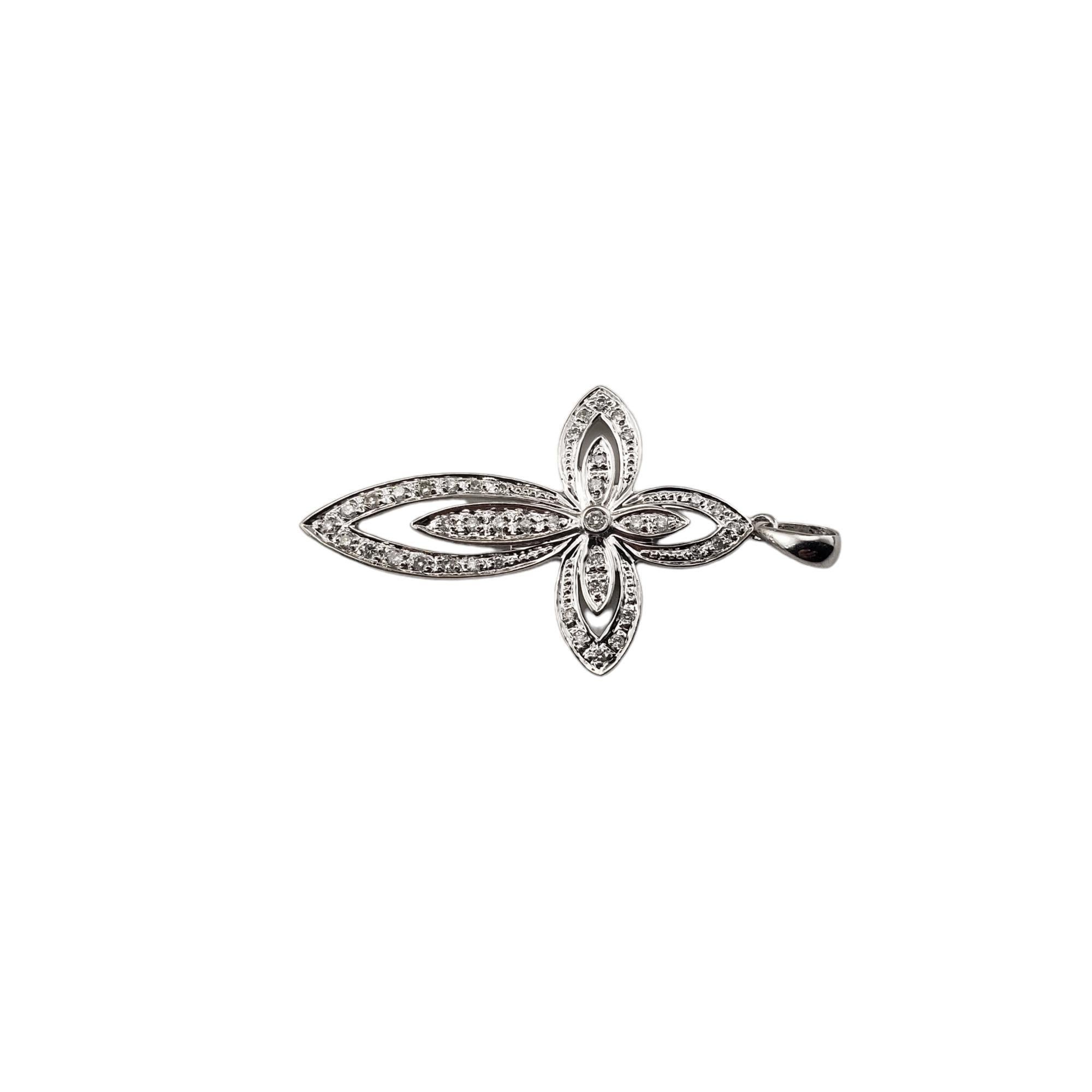 Vintage 14 Karat White Gold Diamond Cross Pendant-

This sparkling cross pendant features 15 round brilliant cut diamonds set in classic 14K white gold.

Approximate total diamond weight:  .08 ct.

Diamond clarity:  SI1-VS2

Diamond color:  H

Size: