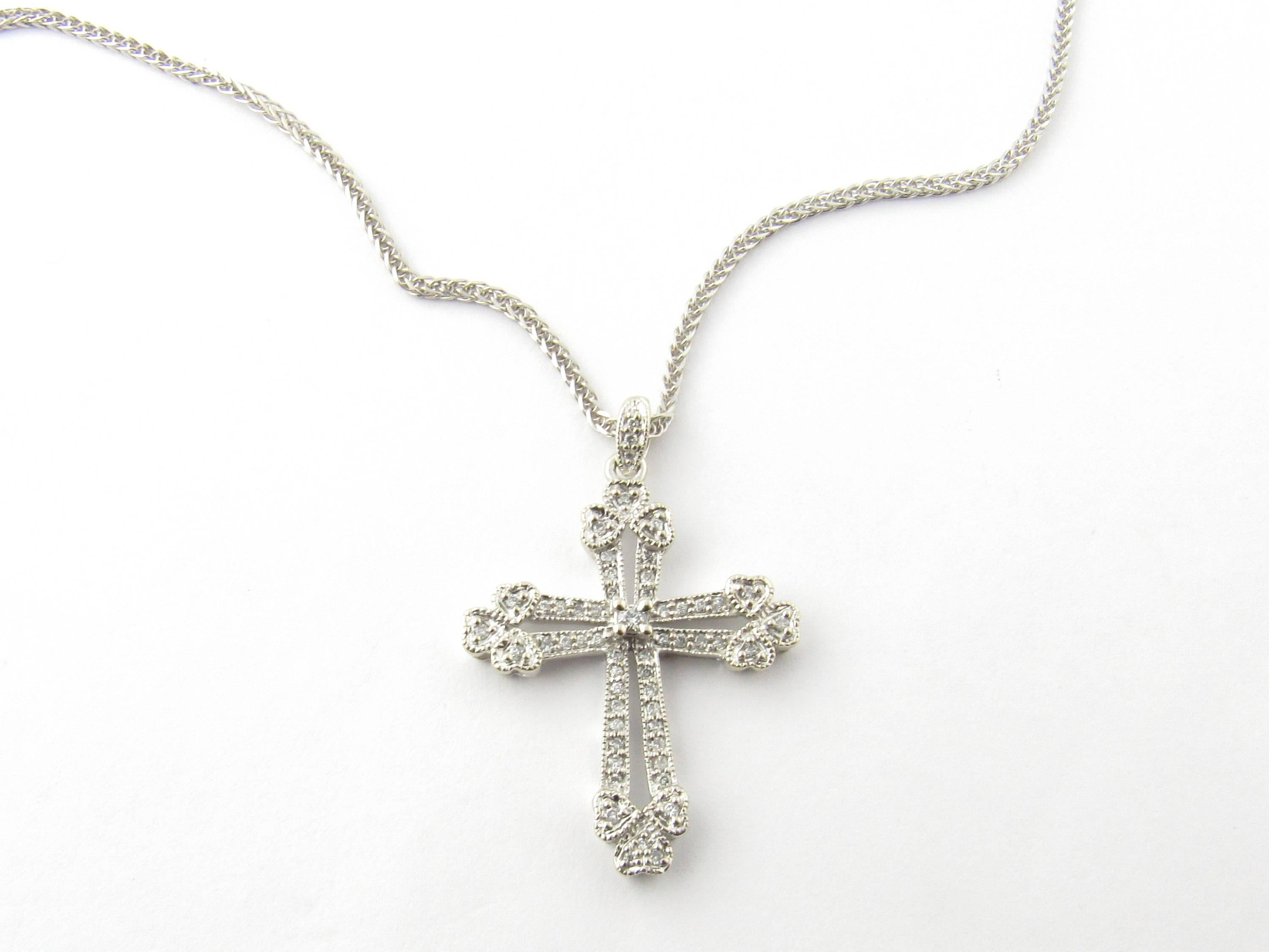Vintage 14 Karat White Gold Diamond Cross Pendant Necklace-

This glittering diamond cross pendant (29 mm x 22 mm) features 54 round brilliant cut diamonds set in meticulously detailed 14K white gold. It hangs from a classic 14K white gold 20 inch