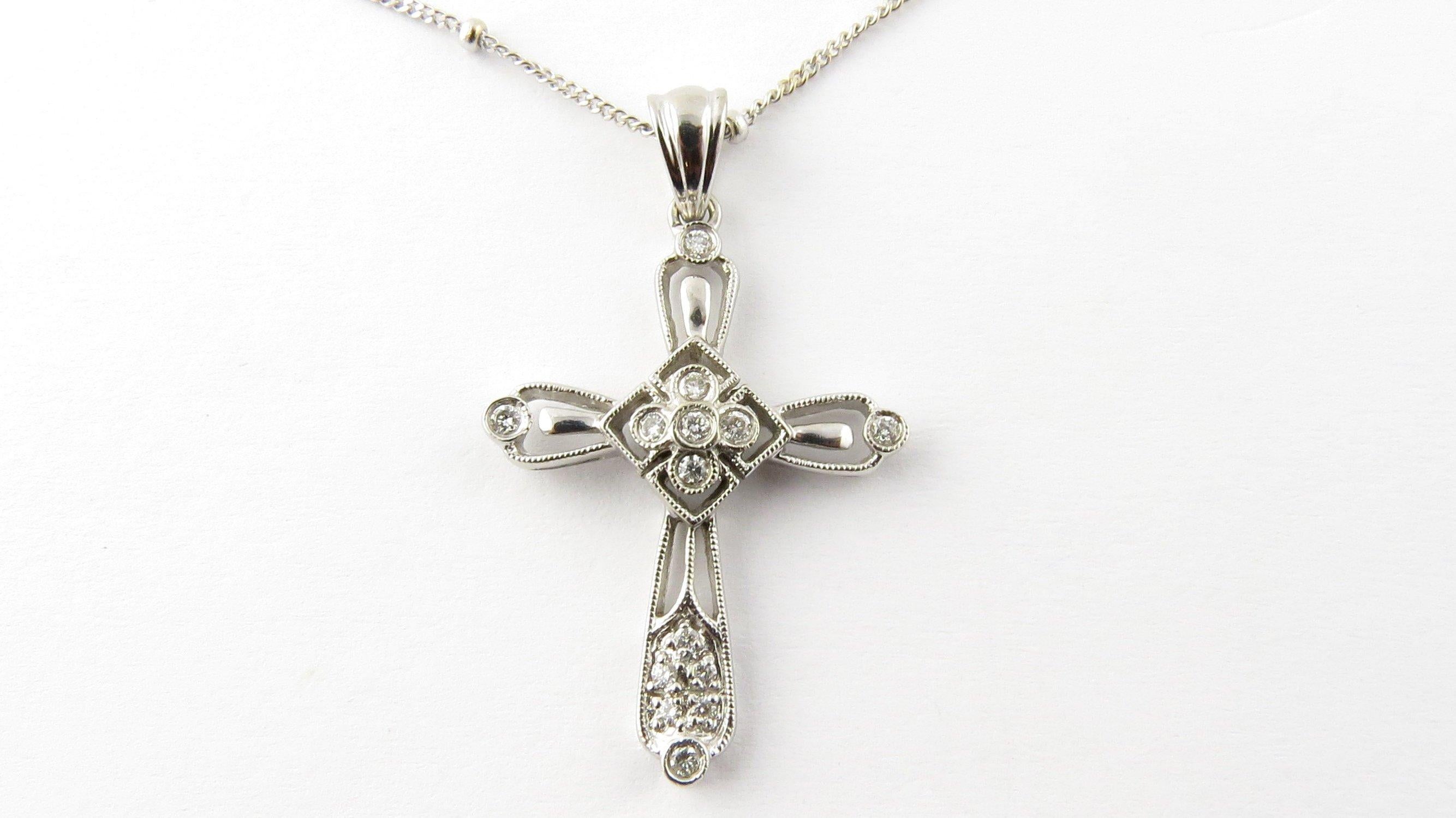 Vintage 14 Karat White Gold Diamond Cross Pendant Necklace- 
This sparkling diamond cross pendant features 14 round brilliant cut diamonds set in stunning 14K white gold. Suspended from lovely beaded 14K white gold necklace. 
Approximated total