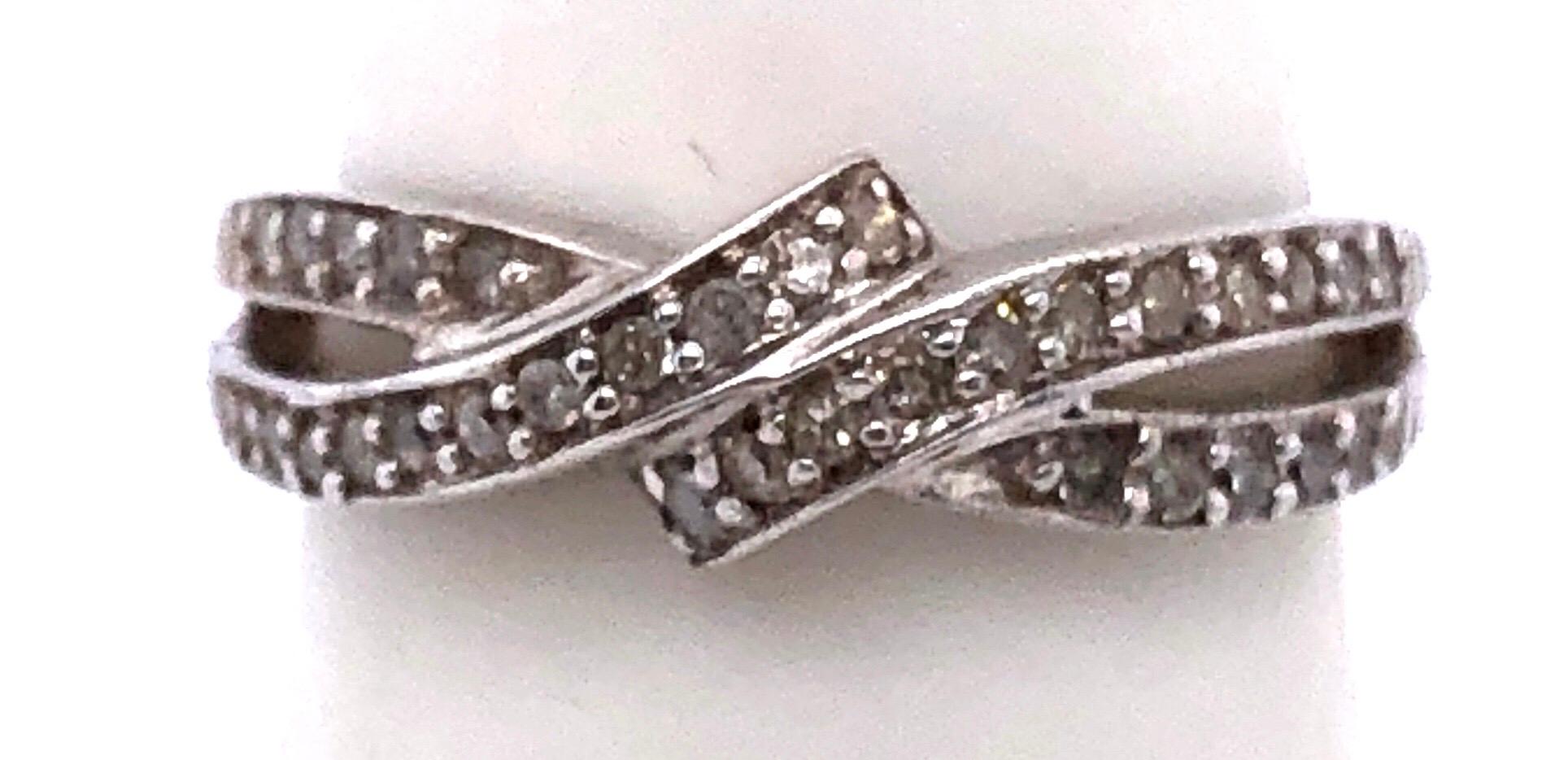 14 Karat White Gold Diamond Crossover Ring Wedding Band Size 7.
0.30 total diamond weight.
2.69 grams total weight.