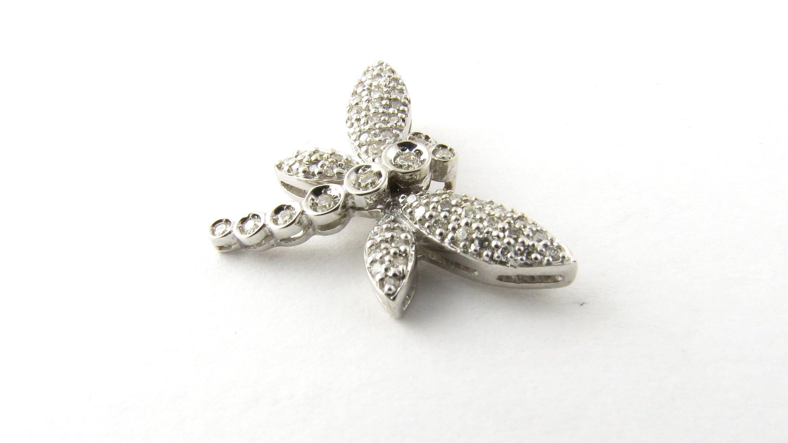Vintage 14 Karat White Gold Diamond Dragonfly Pendant- 
This sparkling pendant features a delicate dragonfly decorated with 62 round brilliant cut diamonds set in classic 14K white gold. 
Approximate total diamond weight: .37 ct. 
Diamond color: J-K