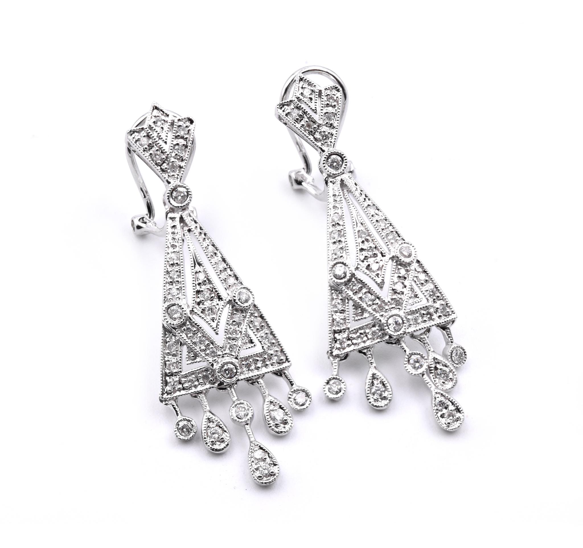 Material: 14K white gold
Diamonds: 84 round cuts = .53cttw
Color: G
Clarity: VS
Dimensions: earrings measure 37.5mm in length and 12.6mm in width 
Fastenings: posts with omega backs
Weight: 5.74 grams