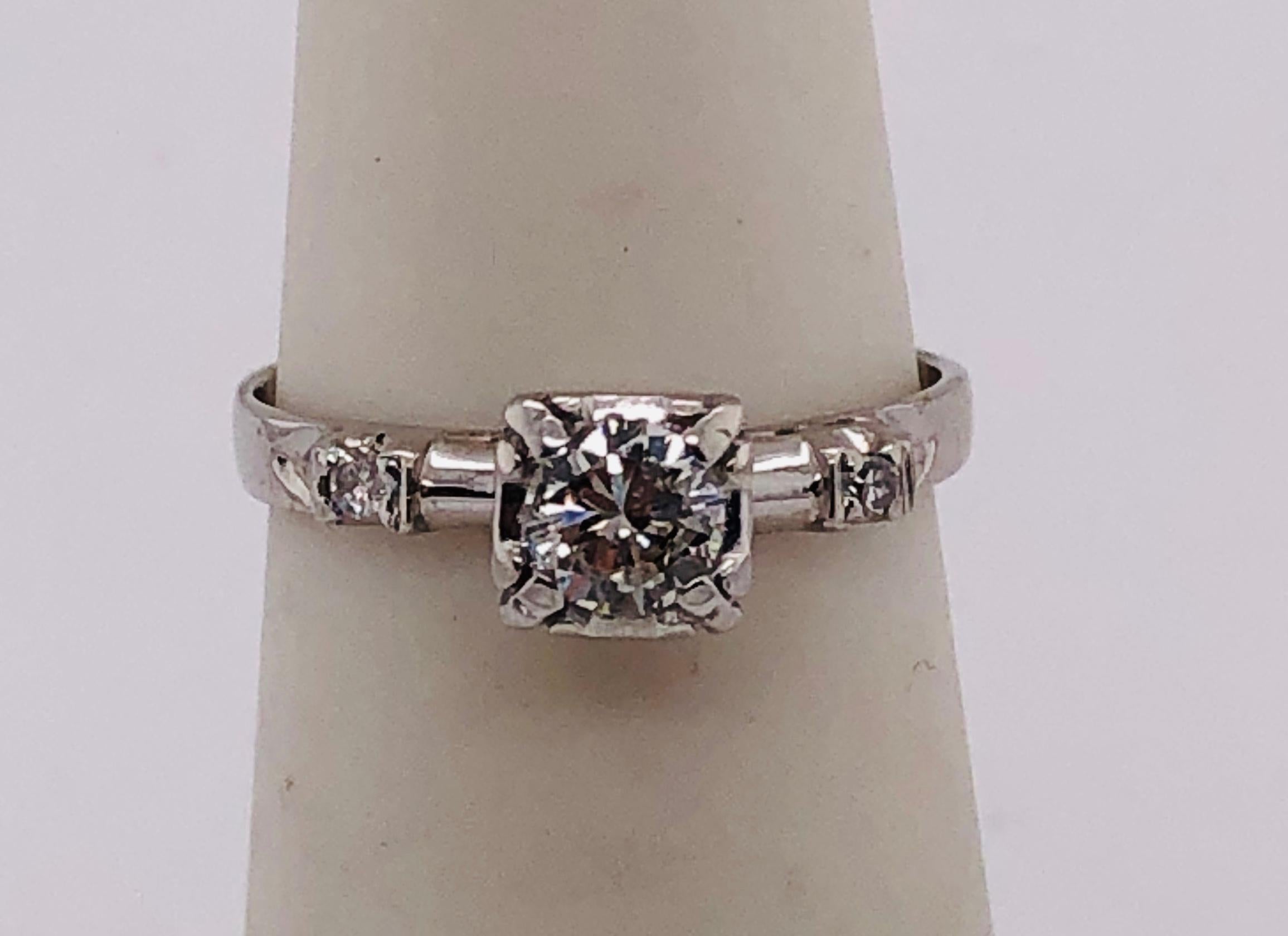 14 Karat White Gold Diamond Engagement Ring 0.60 Total Diamond Weight.
Size 4.75 with 1.95 grams total weight.