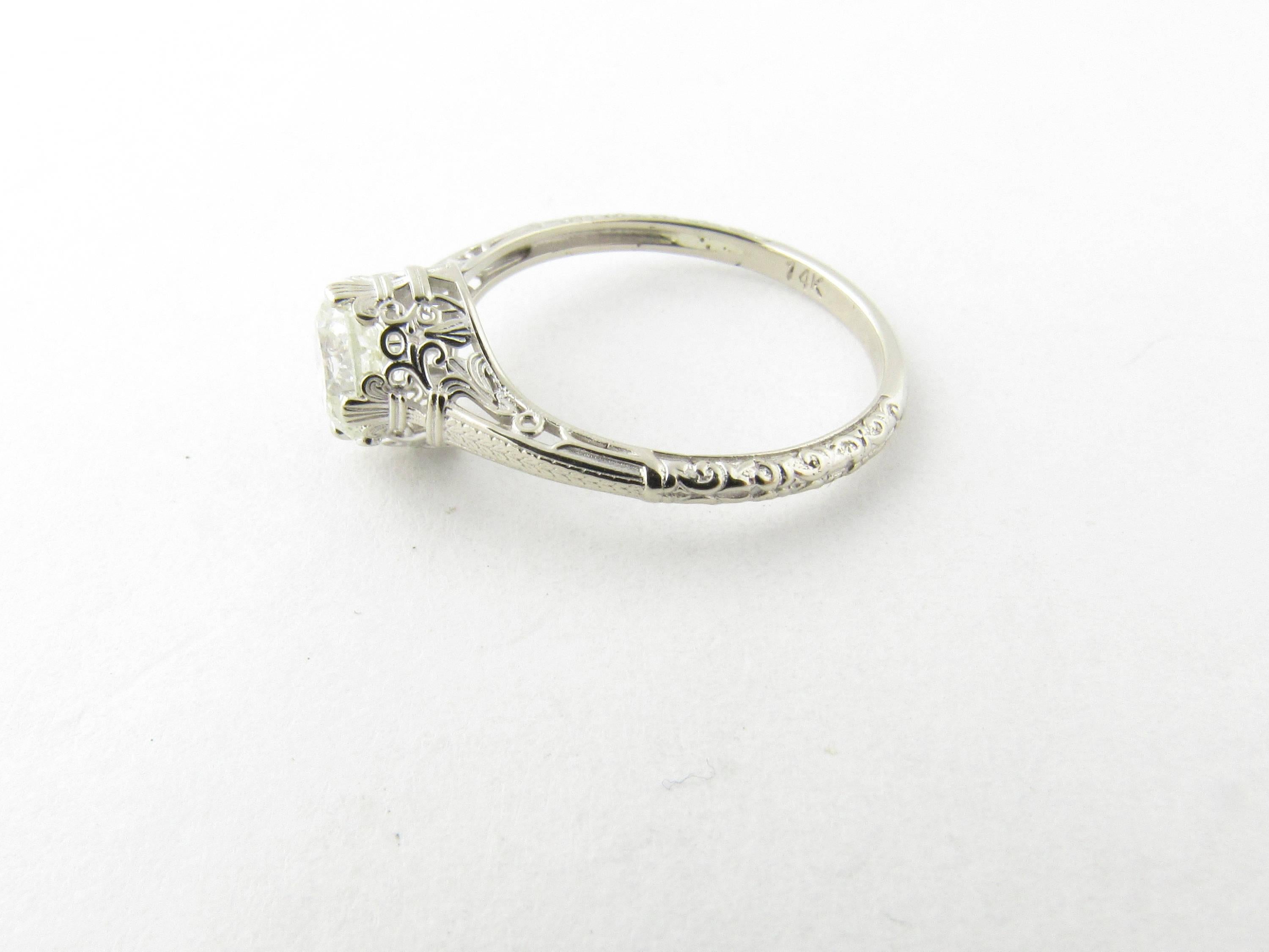 Vintage 14 Karat White Gold Diamond Engagement Ring Size 6.5- 
This sparkling ring features one round brilliant cut diamond set in exquisitely detailed 14K white gold. Shank measures 1.5 mm. 
Approximate total diamond weight: .65 ct. 
Diamond color: