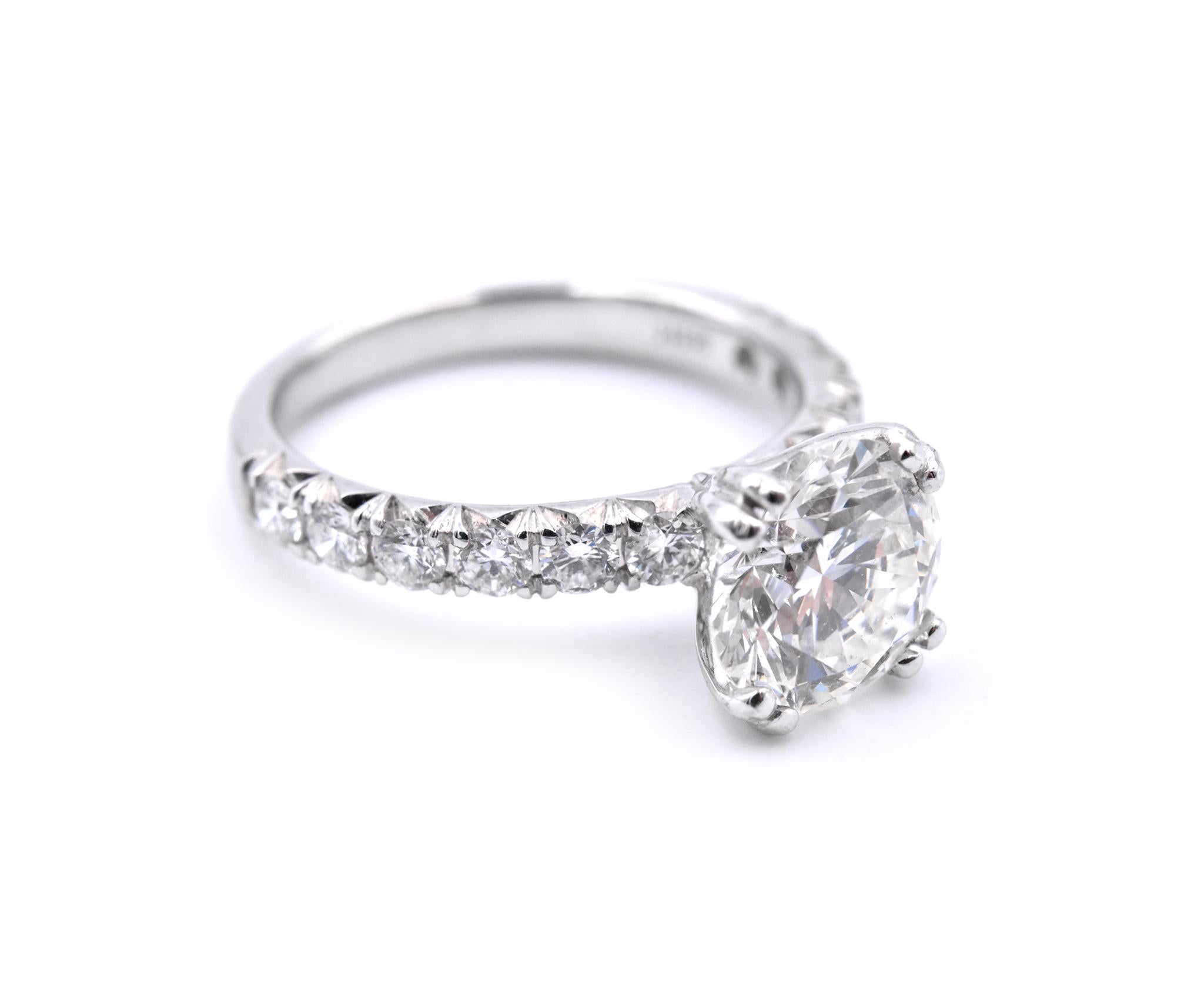 Material: 14k white gold
Center Diamond: 1 round brilliant cut = 2.40ct
Color: J
Clarity: SI2
GIA: 2116304117
Accent Diamonds: 12 round brilliant cuts = .82cttw
Color: G
Clarity: VS
Ring Size: 7 (please allow up to 2 additional business days for