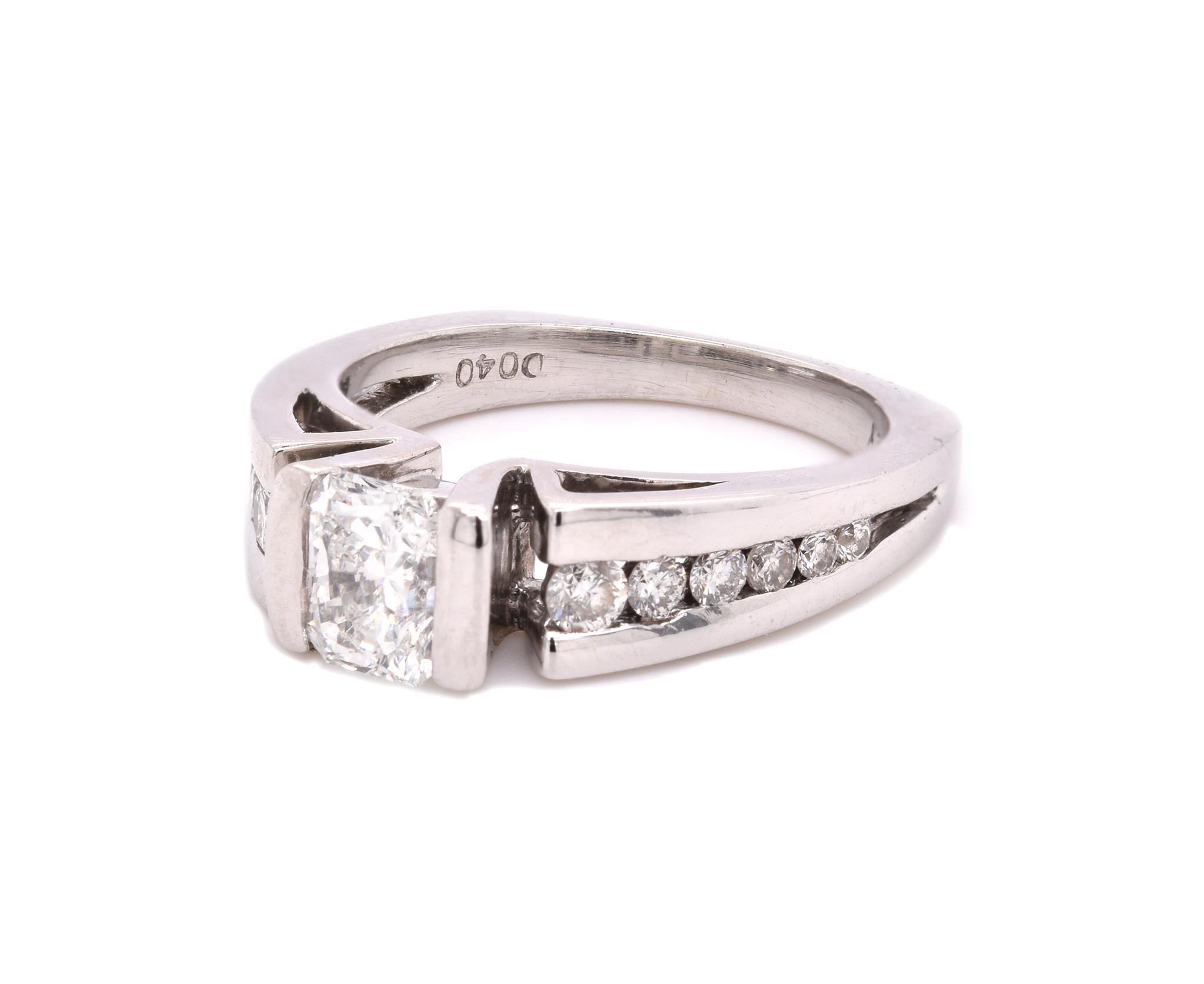 Material: 14k white gold
Center Diamond: 1 radiant cut = .77ct
Color: H
Clarity: VS1
Diamond: 12 round brilliant cut = .40cttw
Color: H
Clarity: VS1
Ring Size: 6.5  (please allow up to 2 additional business days for sizing requests)
Dimensions: ring