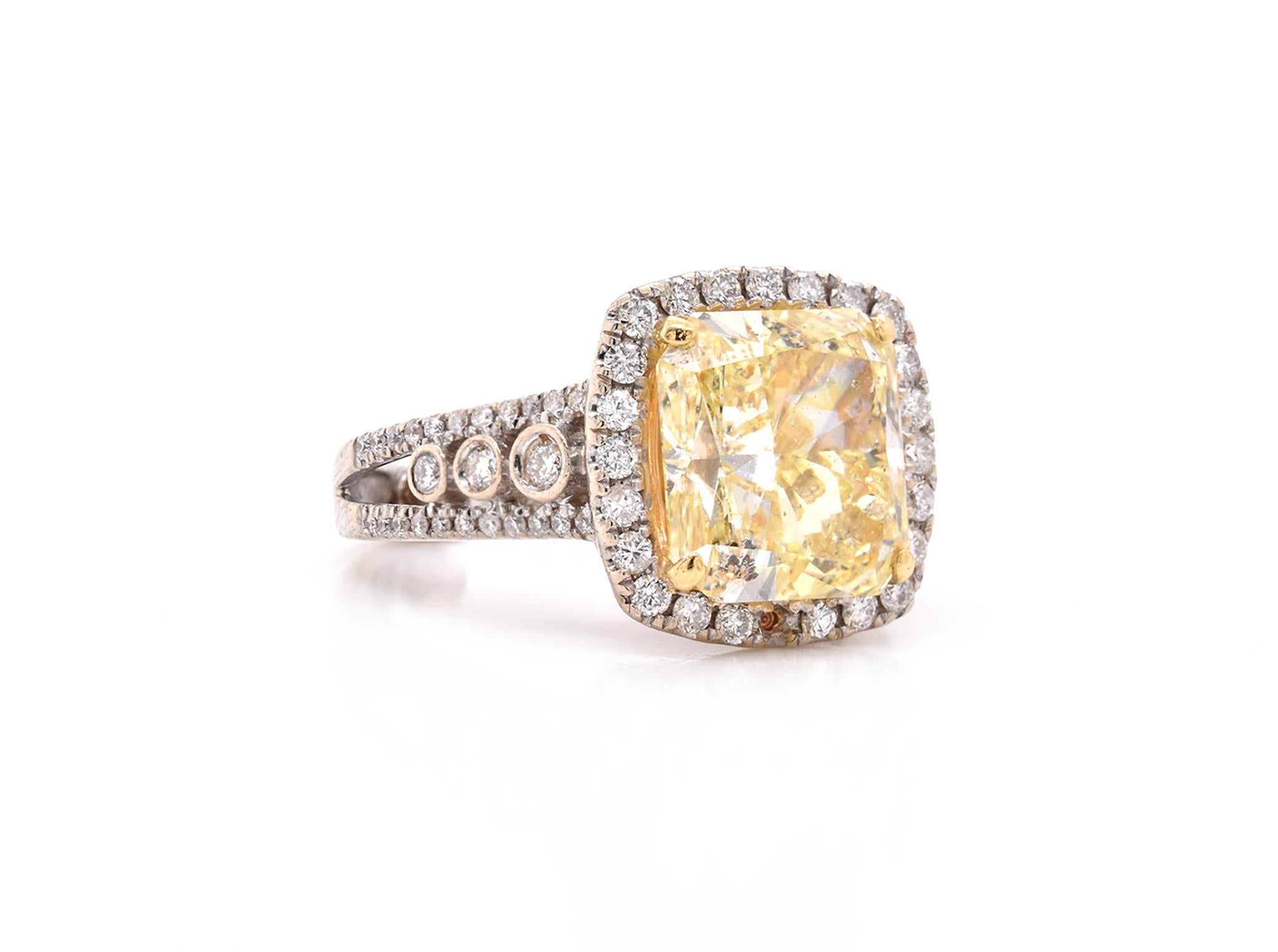 Material: 14K white gold
Center Diamond: 1 cushion cut = 5.04ct
Color: fancy light yellow
Clarity: SI2
Certification: GIA 2125898489
Diamonds: 76 round cut = .75cttw
Color: G
Clarity: VS
Ring Size: 4 (please allow up to 2 additional business days