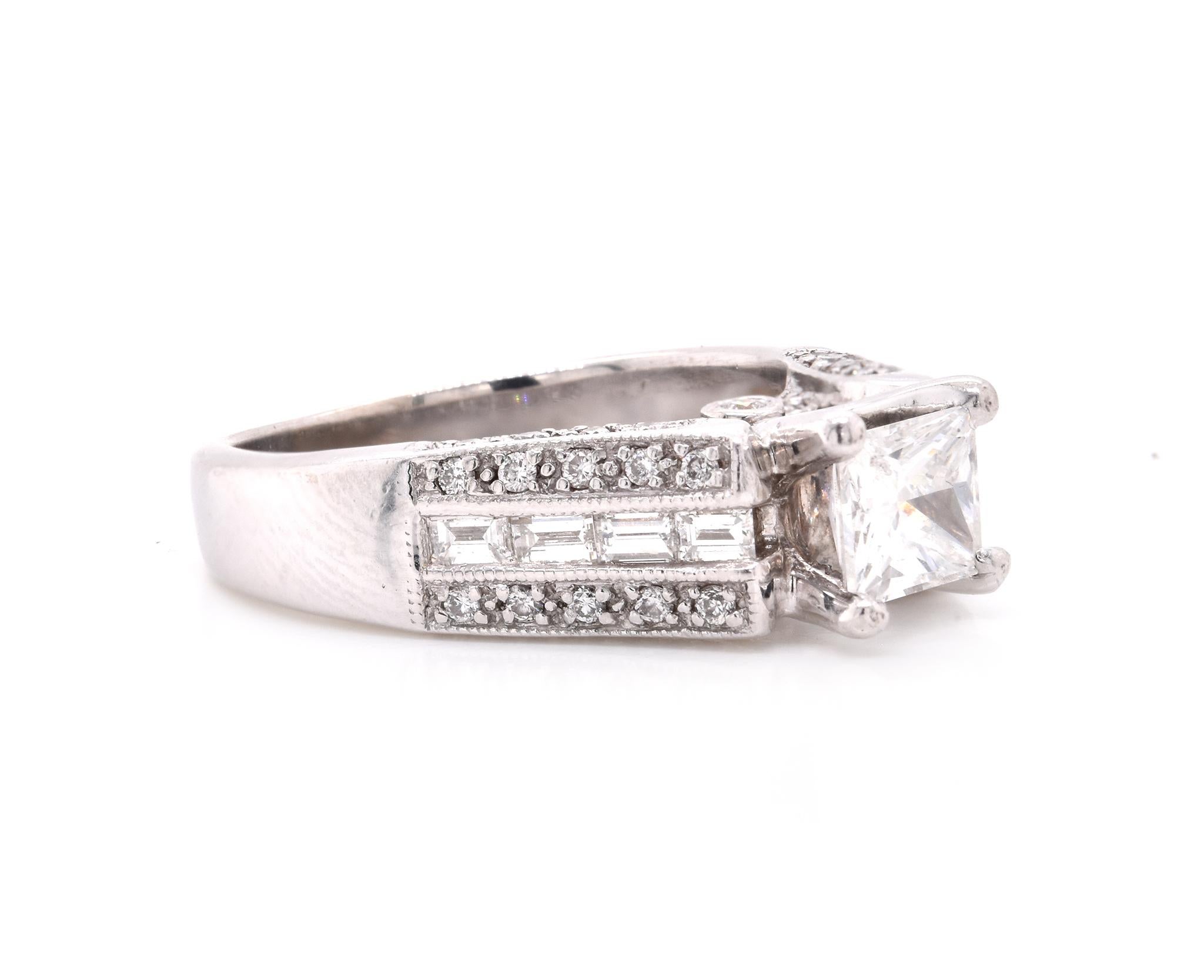 Material: 14K white gold
Center Diamond: 1 princess cut = .61ct
Color: F
Clarity: I1
IGI #: 31673797
Diamonds: 42 round cut = .42cttw
Diamonds: 8 baguette cut = .24cttw
Color: G
Clarity:  VS
Ring Size: 5.5 (please allow up to 2 additional business