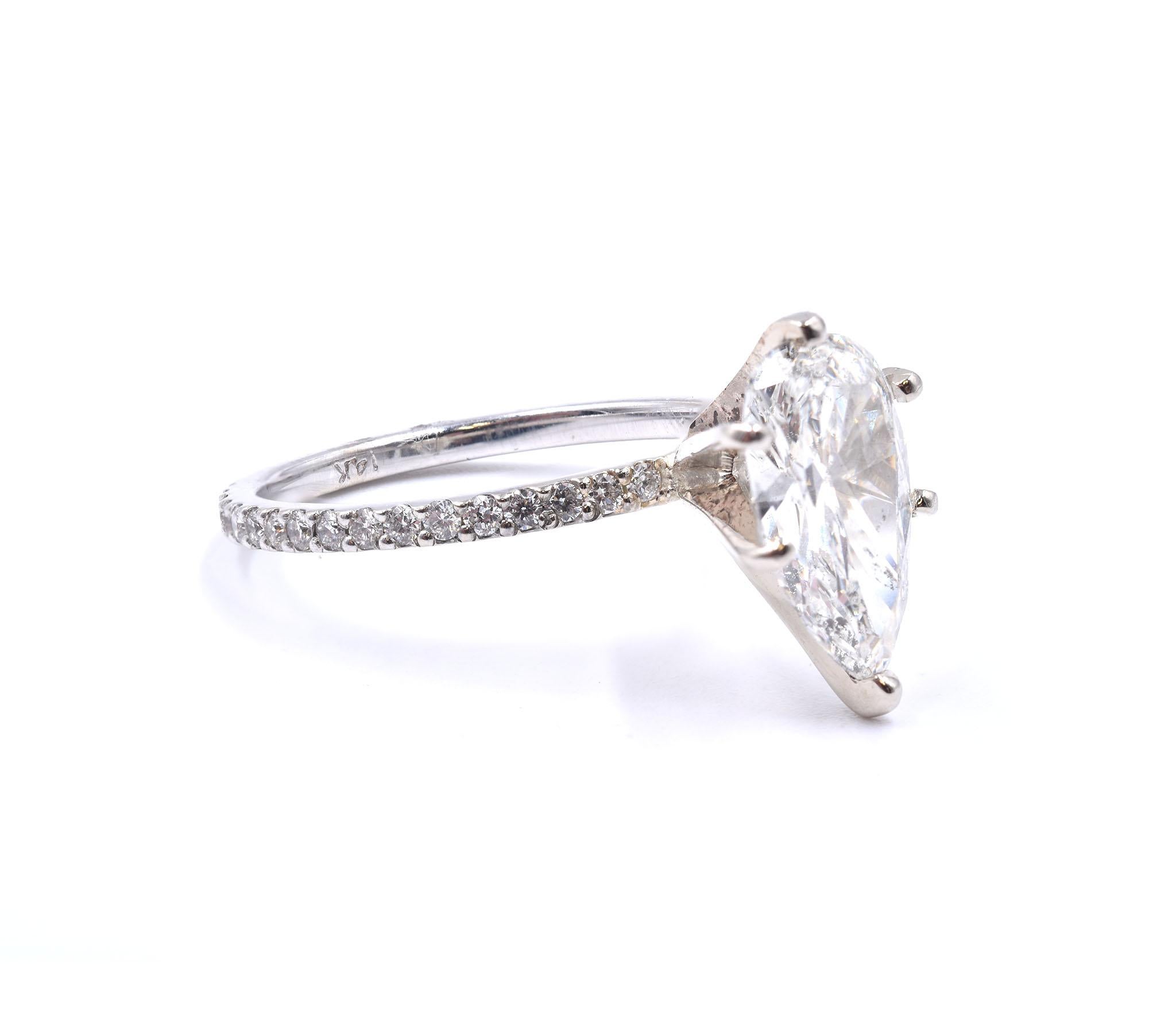 Material: 14K white gold
Center Diamond: 1 pear cut = 1.75ct
Color: J
Clarity: SI2
Diamond: 12 round cut = .50cttw
Color: G
Clarity: VS
Ring Size: 6.5 (please allow up to 2 additional business days for sizing requests)
Dimensions: ring shank
