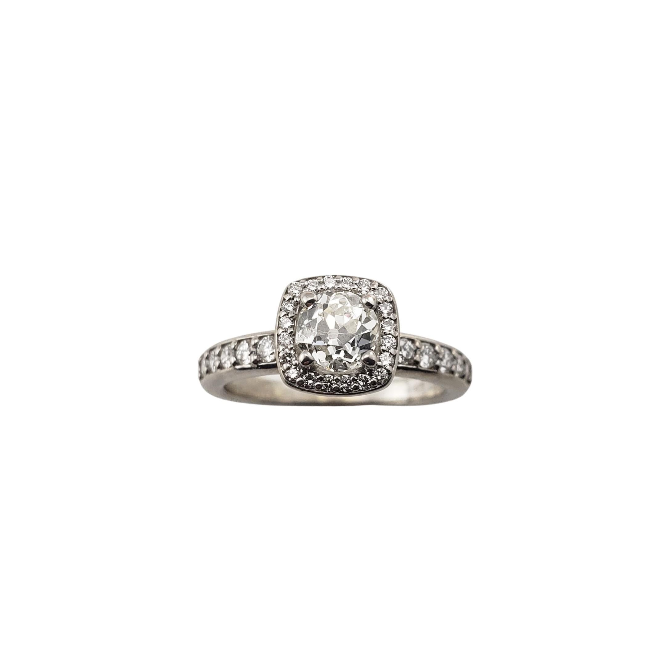 14 Karat White Gold Diamond Engagement Ring Size 5.5-

This sparkling ring features one center round old mine cut diamond (.45 ct.) surrounded by 32 round brilliant cut diamonds set in beautifully detailed 14K white gold.  Shank:  2 mm.

Approximate