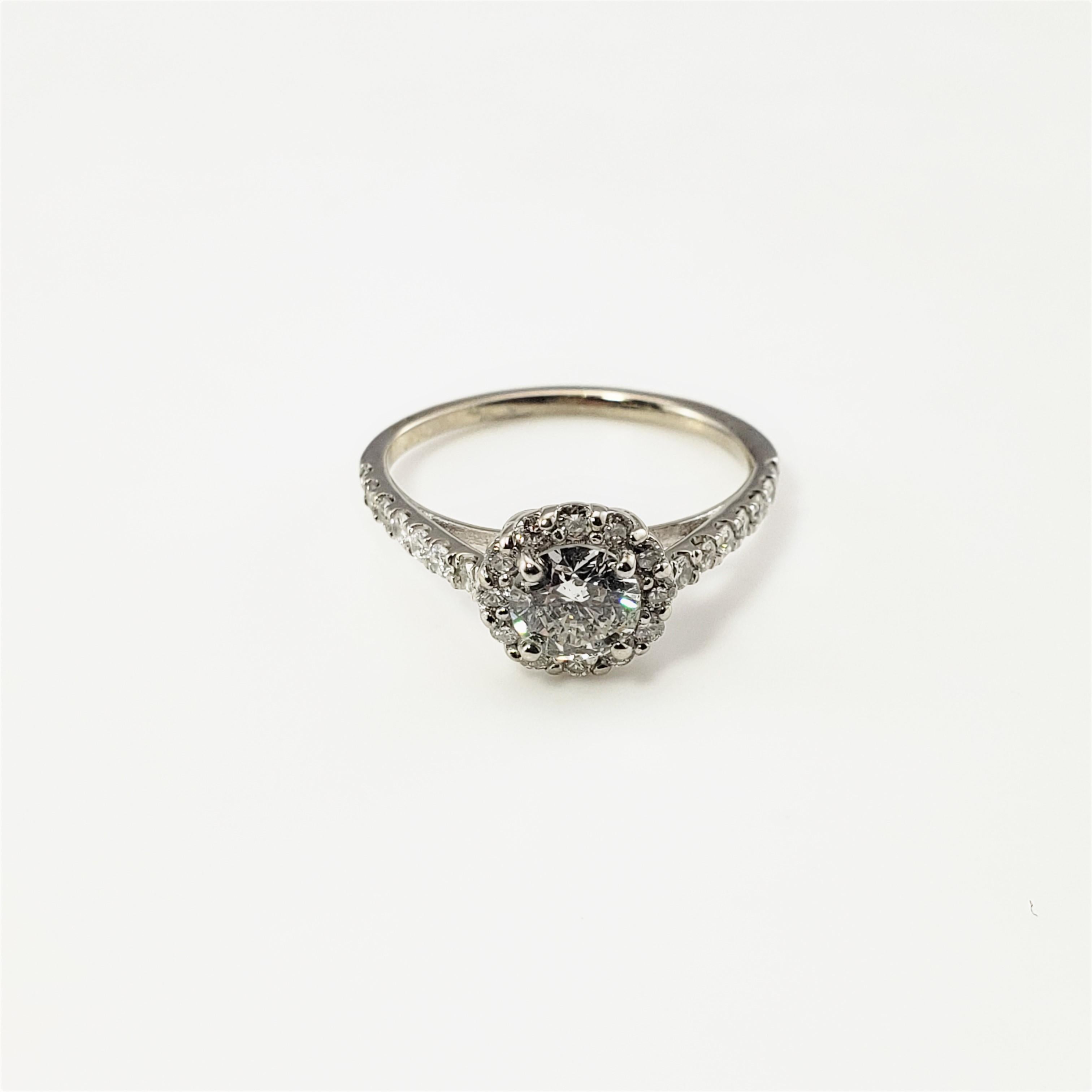 14 Karat White Gold Diamond Engagement Ring Size 5.5 GAI Certified-

This sparkling engagement ring features 27 round brilliant cut diamonds (center stone: .57 TCW) set in beautifully detailed 14K white gold.  Top of ring measures 8 mm.  Shank