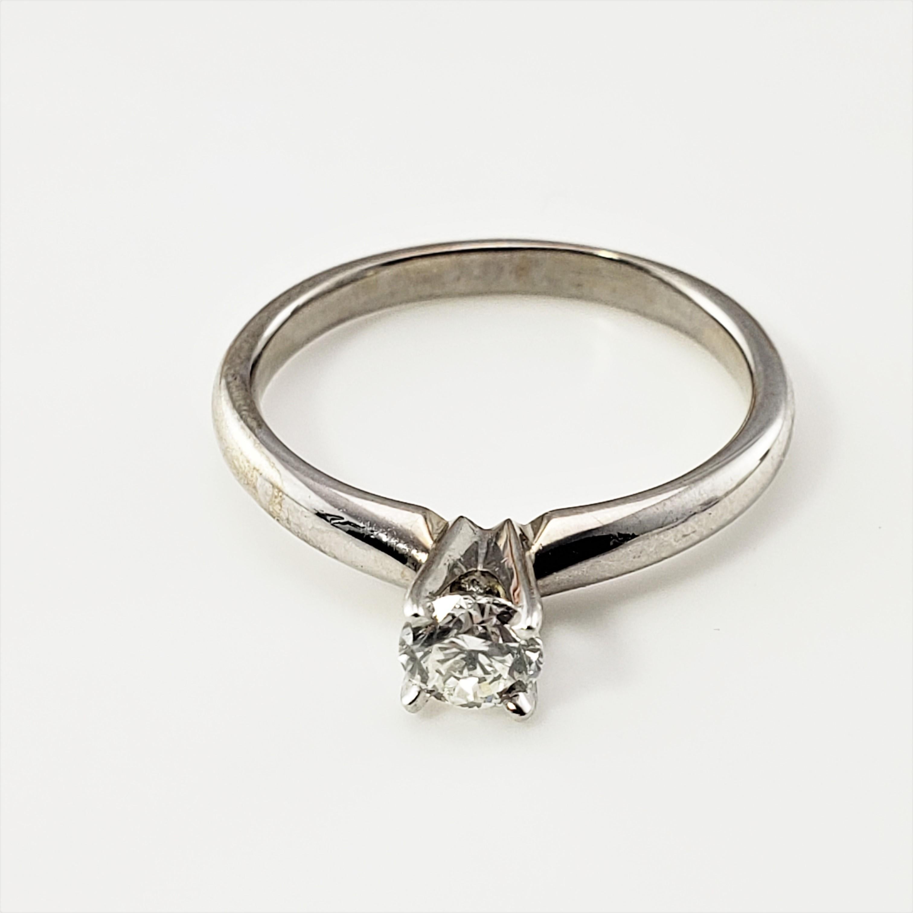 14 Karat White Gold Diamond Engagement Ring Size 6 (.30 ct.)-

This sparkling engagement ring features one round brilliant cut diamond set in classic 14K white gold.  Shank: 2 mm.

Approximate total diamond weight:  .30 ct.

Diamond color: 