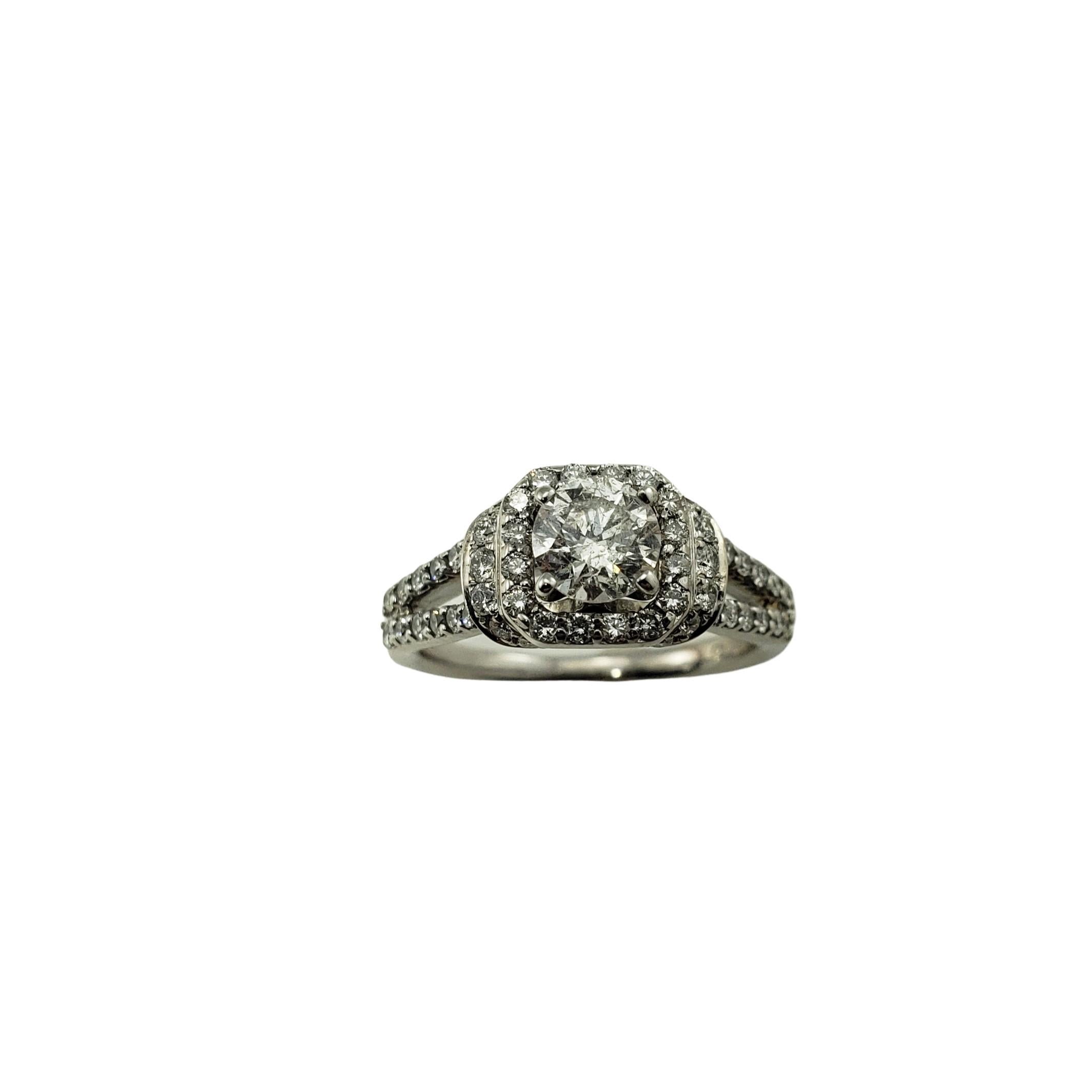 14 Karat White Gold Diamond Engagement Ring Size 6.25 GAI Certified-

This sparkling ring features one round brilliant cut diamond (.70 ct.) surrounded by 60 round brilliant cut diamonds on the halo and band.  Shank:  1.5 mm.

Approximate total