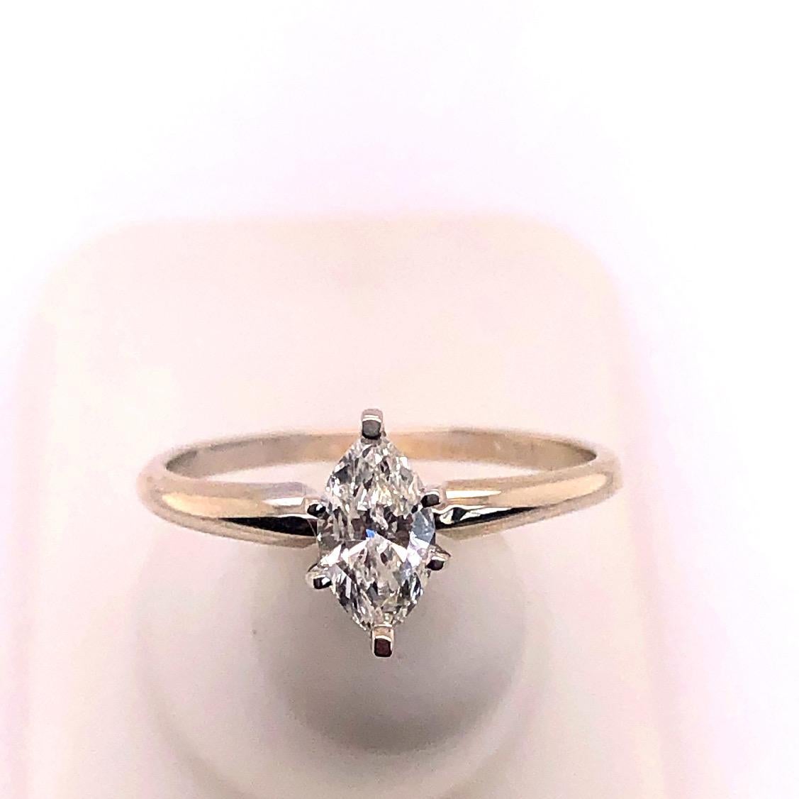 14 Karat White Gold Diamond Engagement Ring Size 7.
0.75 total diamond weight.
1.92 grams total weight.