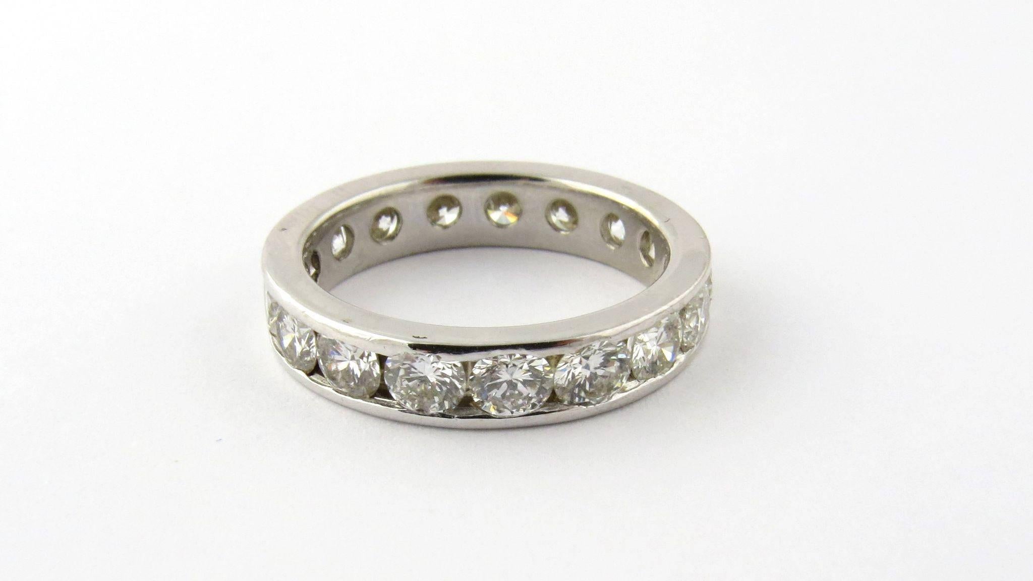Vintage 14K White Gold Diamond Eternity Band Size 5.5 

This diamond band is channel set with 17 round brilliant diamonds. Each diamond is approximately .13 carats for a total carat weight of approx. 2.21 carats. Diamonds are of SI1 clarity and J
