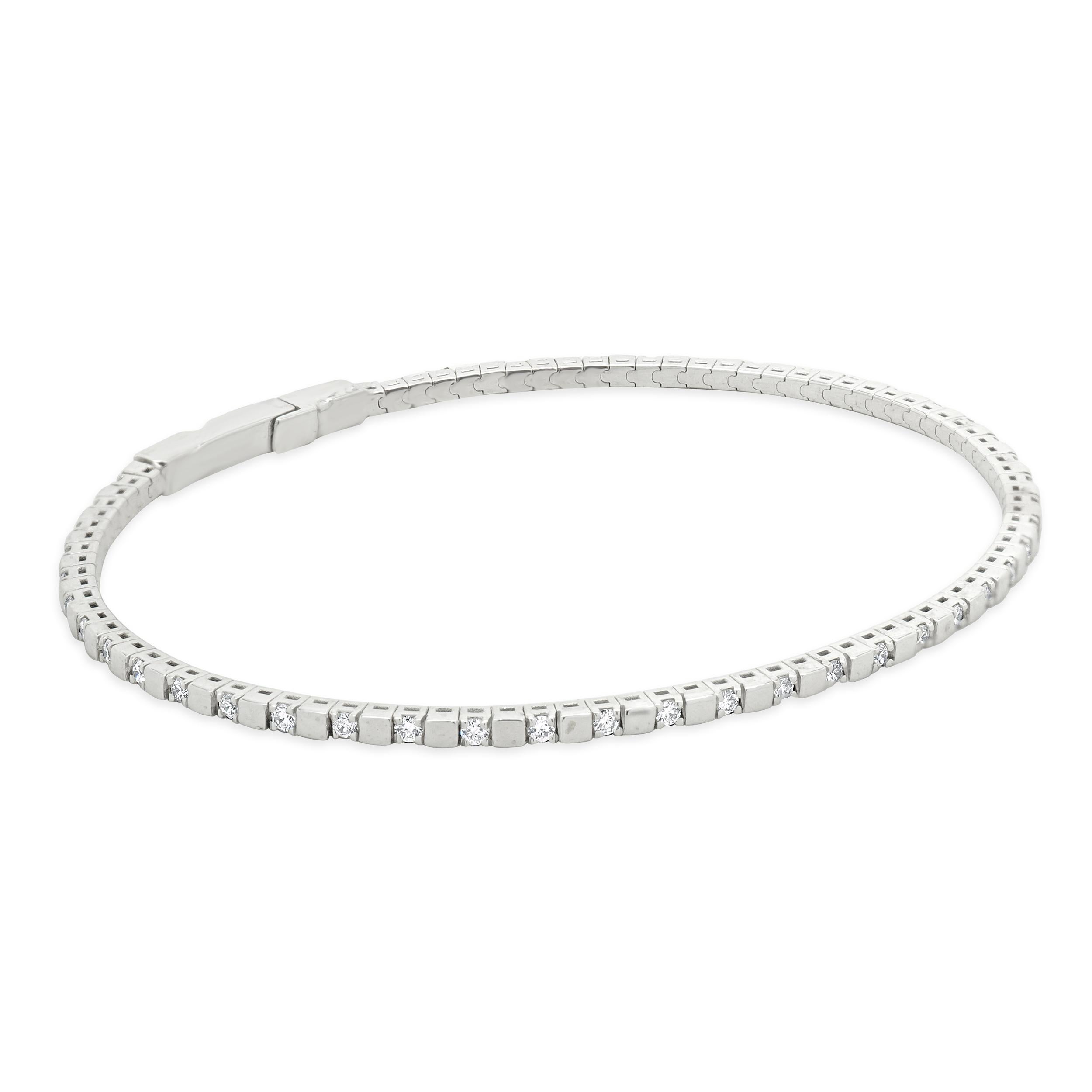 Material: 14K white gold
Diamonds: round brilliant cut = 0.62cttw
Color: G
Clarity: SI1
Dimensions: bracelet will fit up to a 6.5-inch wrist
Weight: 5.82 grams
