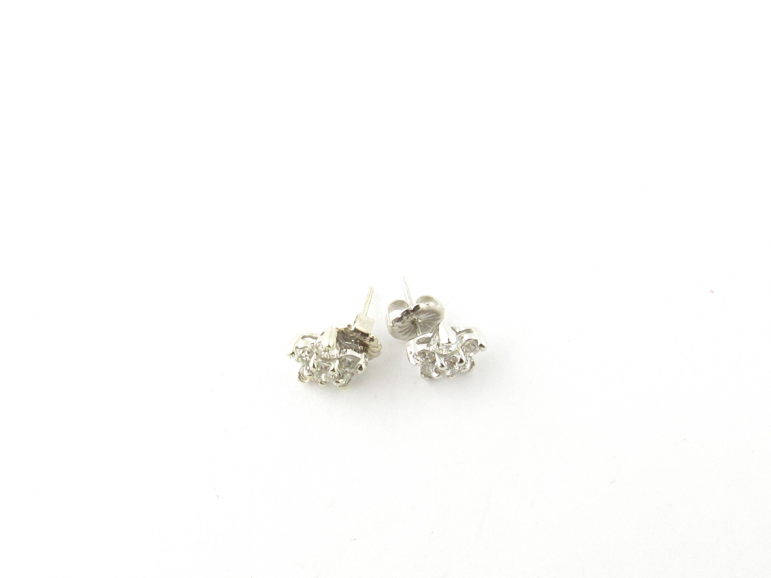 Vintage 14 Karat White Gold Diamond Flower Earrings-

These sparkling earrings each feature six round old mine cut diamonds set in an exquisite flower design.

Approximate total diamond weight: 1.20 cts.

Diamond color: H

Diamond clarity: