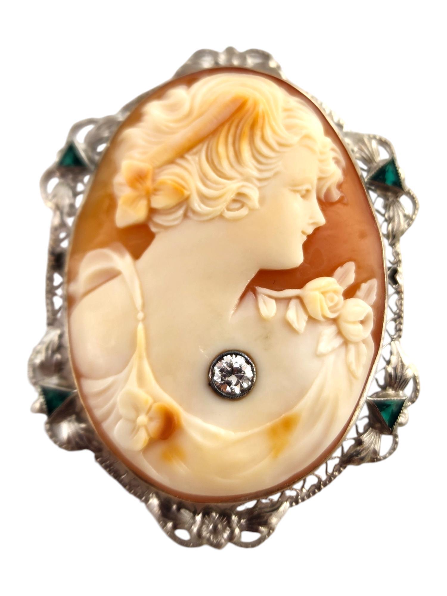 14 Karat White Gold Diamond & Green Stone Cameo Brooch/Pendant

This gorgeous cameo brooch/pendant was meticulously crafted from 14K white gold and is decorated with 4 green faceted trillions and 1 sparkling round brilliant cut diamond!

Approximate