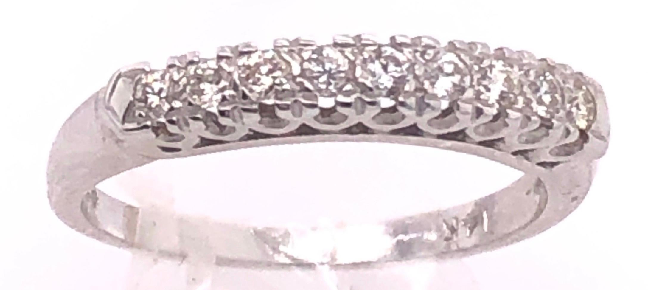 14 Karat White Gold Diamond Half Anniversary Bridal Ring / Wedding Band
0.27 total diamond weight.
Size 5.5 with 2.0 grams total weight