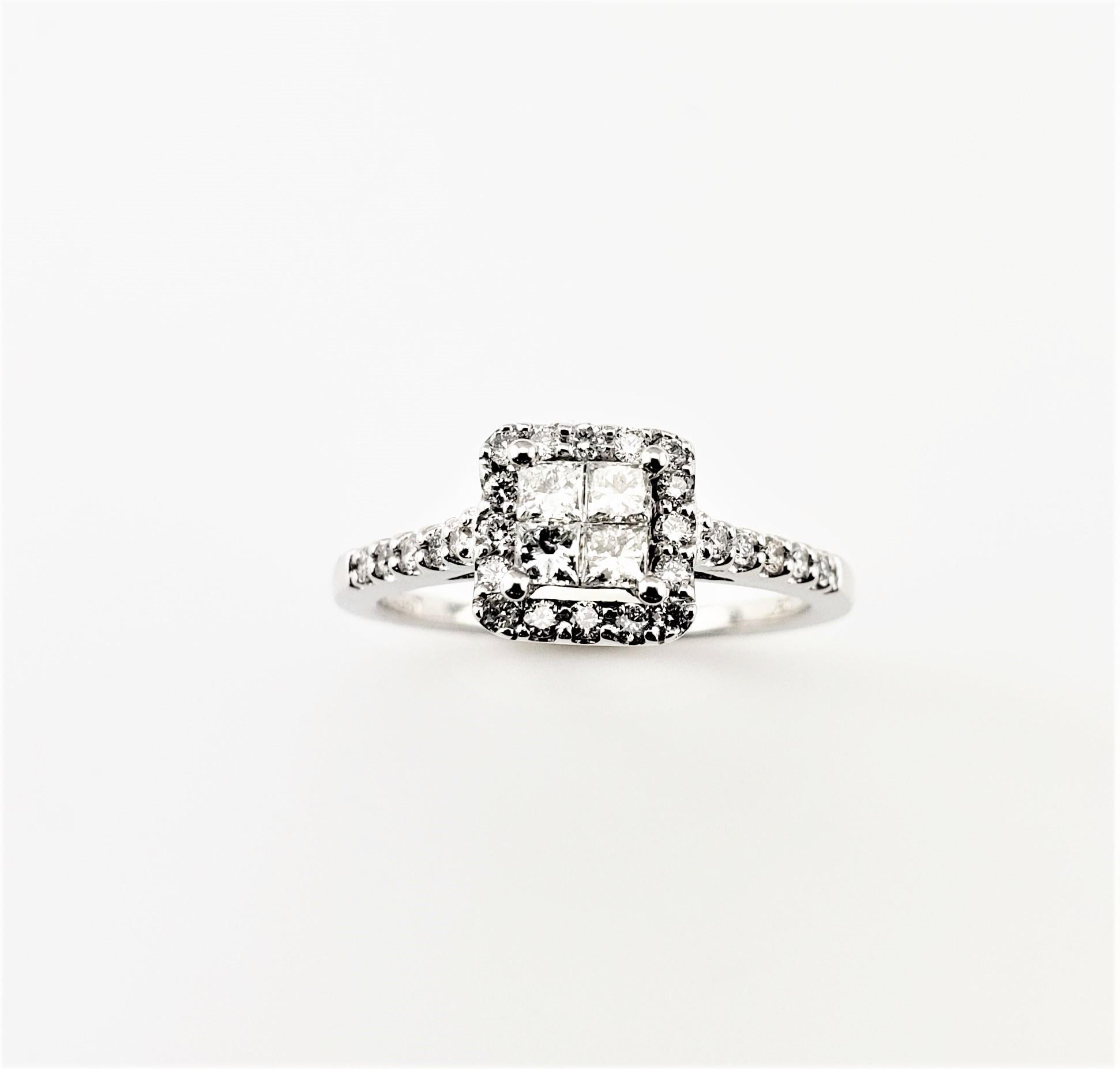 Vintage 14 Karat White Gold Diamond Halo Ring Size 6.5-

This sparkling ring features four princess cut diamonds in its center (.20 ct. TWT.) and 26 round brilliant cut diamonds (.30 ct. TWT.) on its band and halo. Width: 8 mm. Shank: 1.5