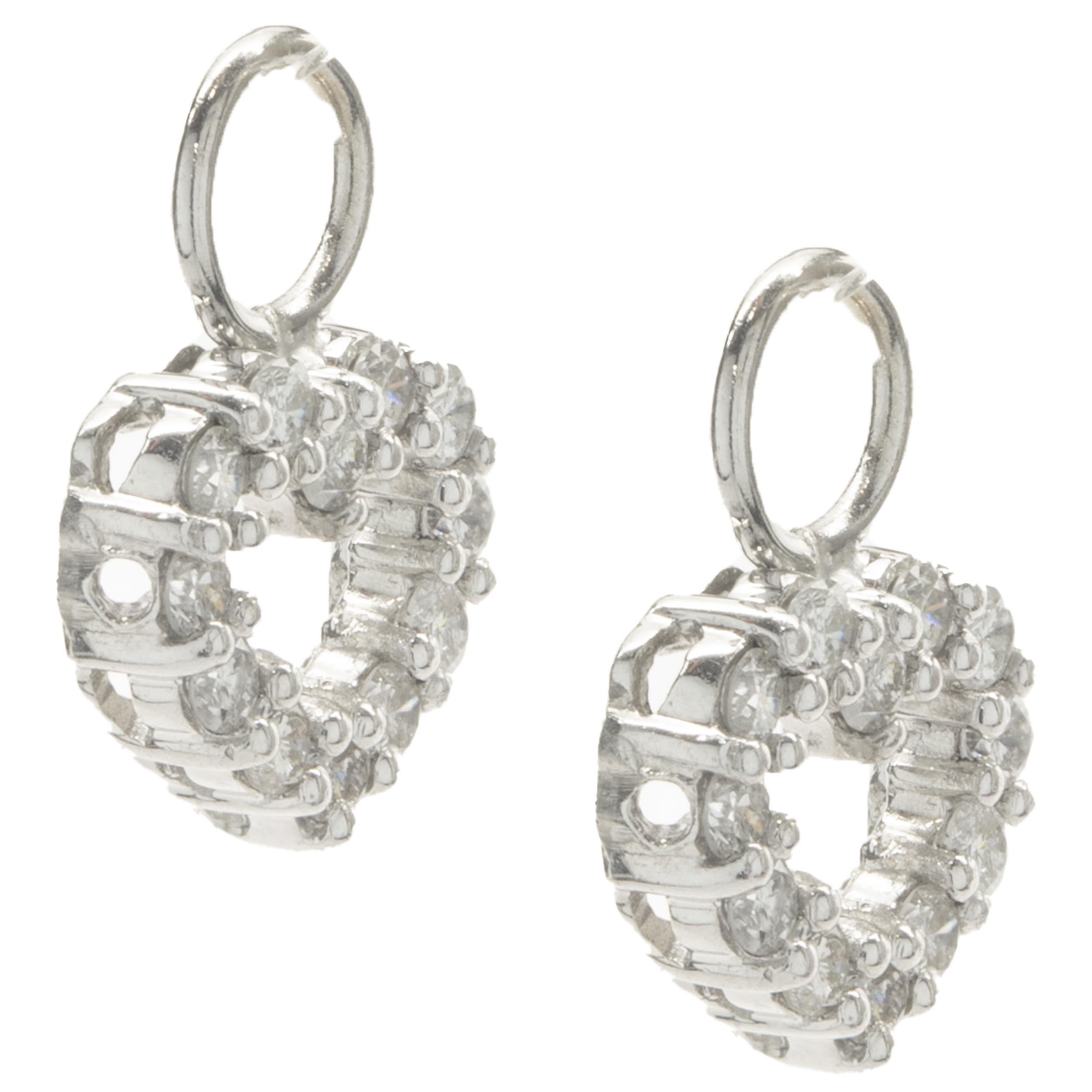 Designer: custom design
Material: 14K white gold
Diamonds: 24 round brilliant cut = 0.70cttw
Color: G
Clarity: SI1
Dimensions: earrings measure 12.60mm in length
Weight: 1.49 grams