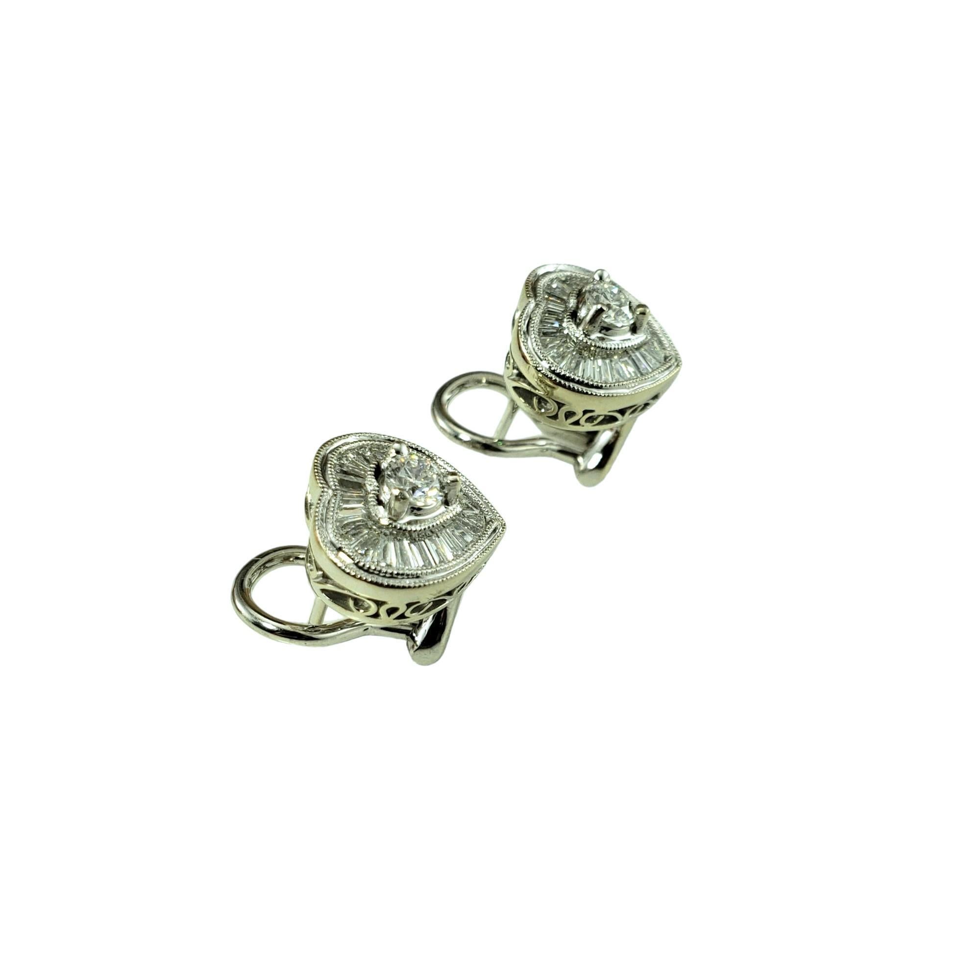 Vintage 14K White Gold Diamond Heart Earrings-

These sparkling heart earrings each feature 23 baguette diamonds and one round brilliant cut diamond set in beautifully detailed 14K white gold. 

 Omega back closures.

Approximate total diamond