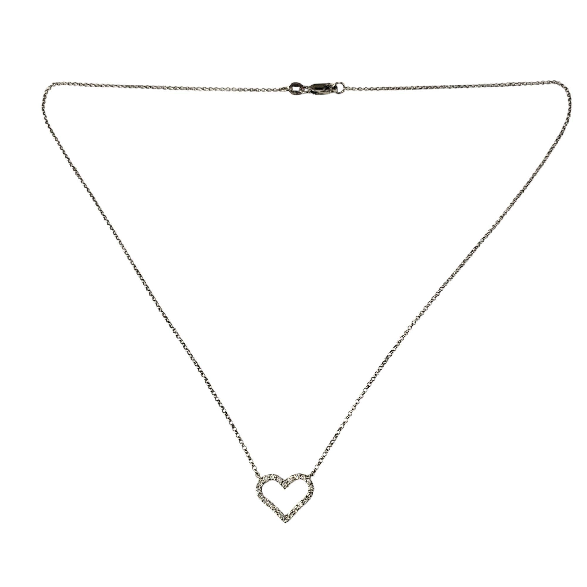 14 Karat White Gold Diamond Heart Pendant Necklace

Romantic and timeless, this 14K white gold necklace features a sparkling heart-shaped pendant adorned with 22 round brilliant cut diamonds.

Approximate total diamond weight: .20 ct.

Diamond
