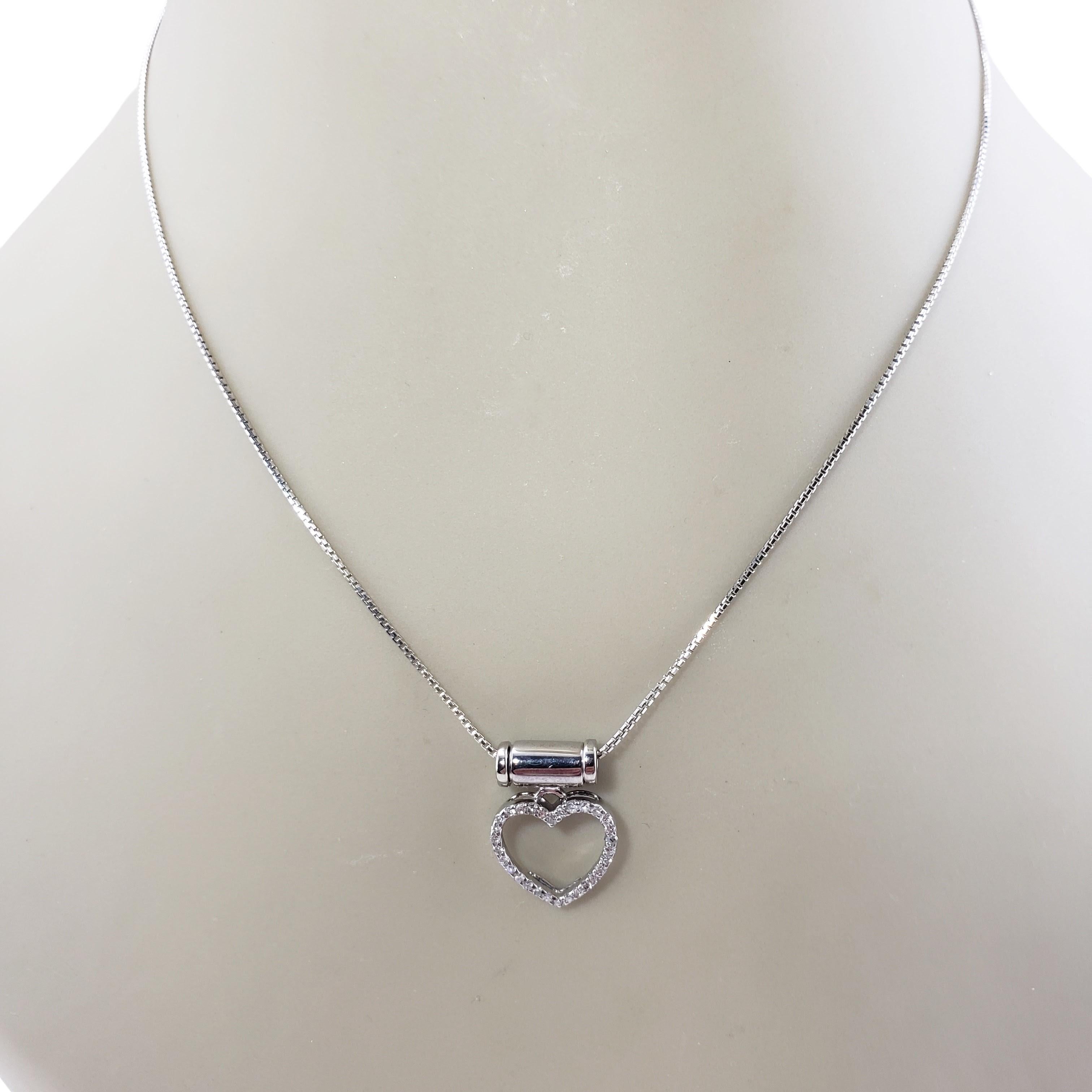 Vintage 14 Karat White Gold Diamond Heart Pendant Necklace-

This sparkling heart pendant necklace features 30 round single cut diamonds set in elegant 14K white gold. Suspends from a classic box chain.

Approximate total diamond weight: .15