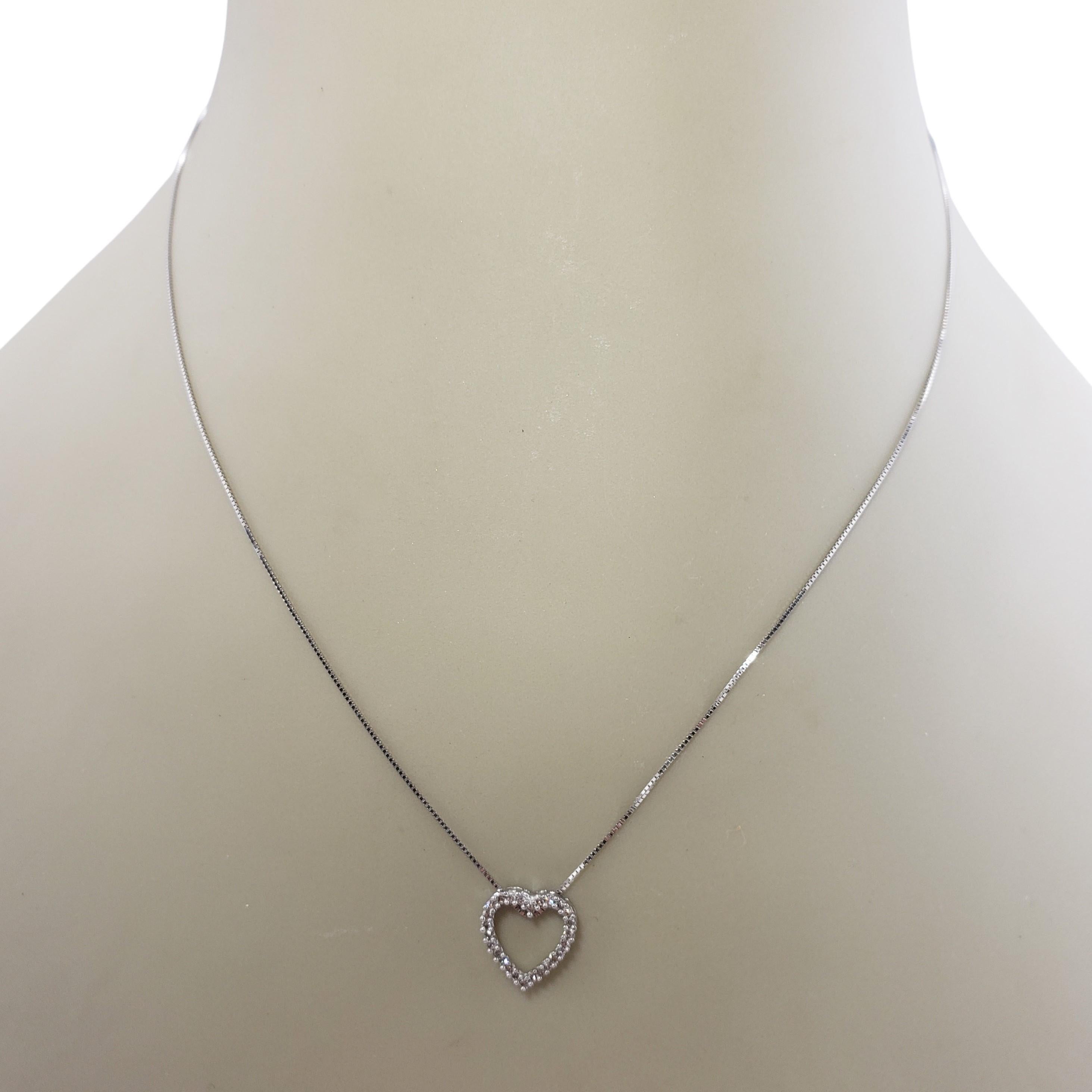 heart necklace with diamond in the middle