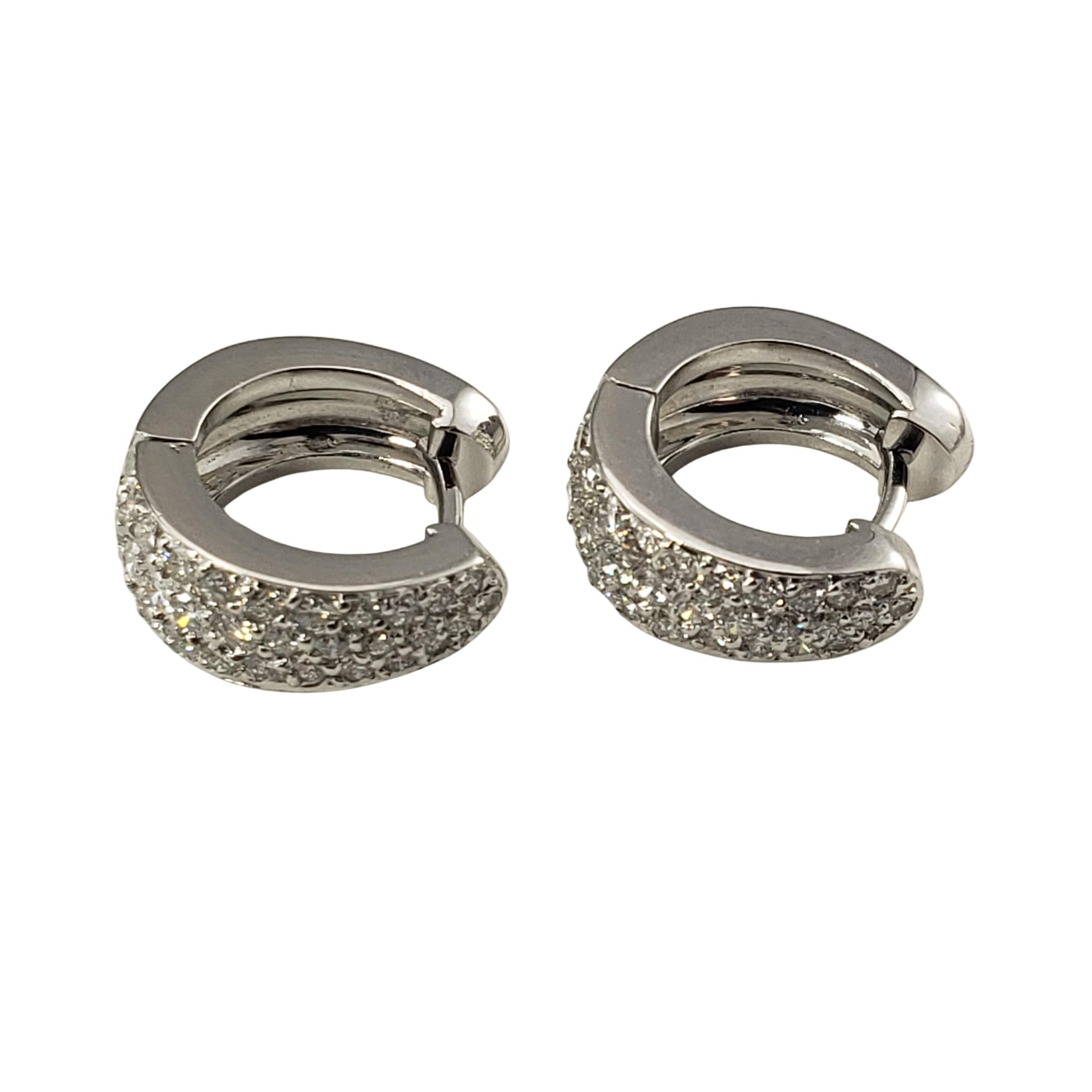 14 Karat White Gold and Diamond Hoop Earrings-

These sparkling hinged hoop earrings each feature 31 round brilliant cut diamonds set in classic 14K white gold.  Width:  5 mm.

Approximate total diamond weight:  1.20 ct.

Diamond color:  G

Diamond